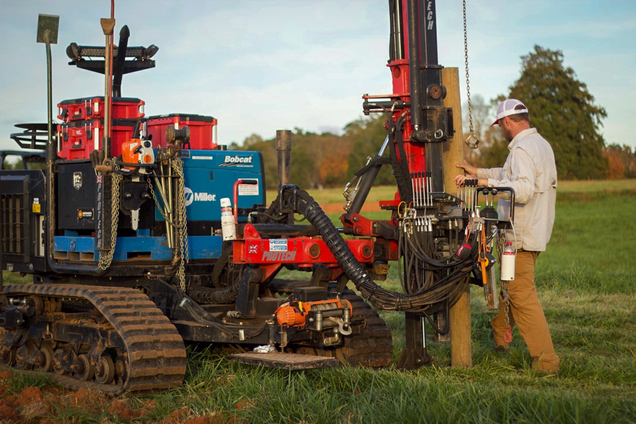 Ryan prepares a log to be punched into the ground on his property in Mt. Ulla, NC. "My hope is that in the next five years, we got a whole group of guys driving around the Carolinas with this kind of equipment."