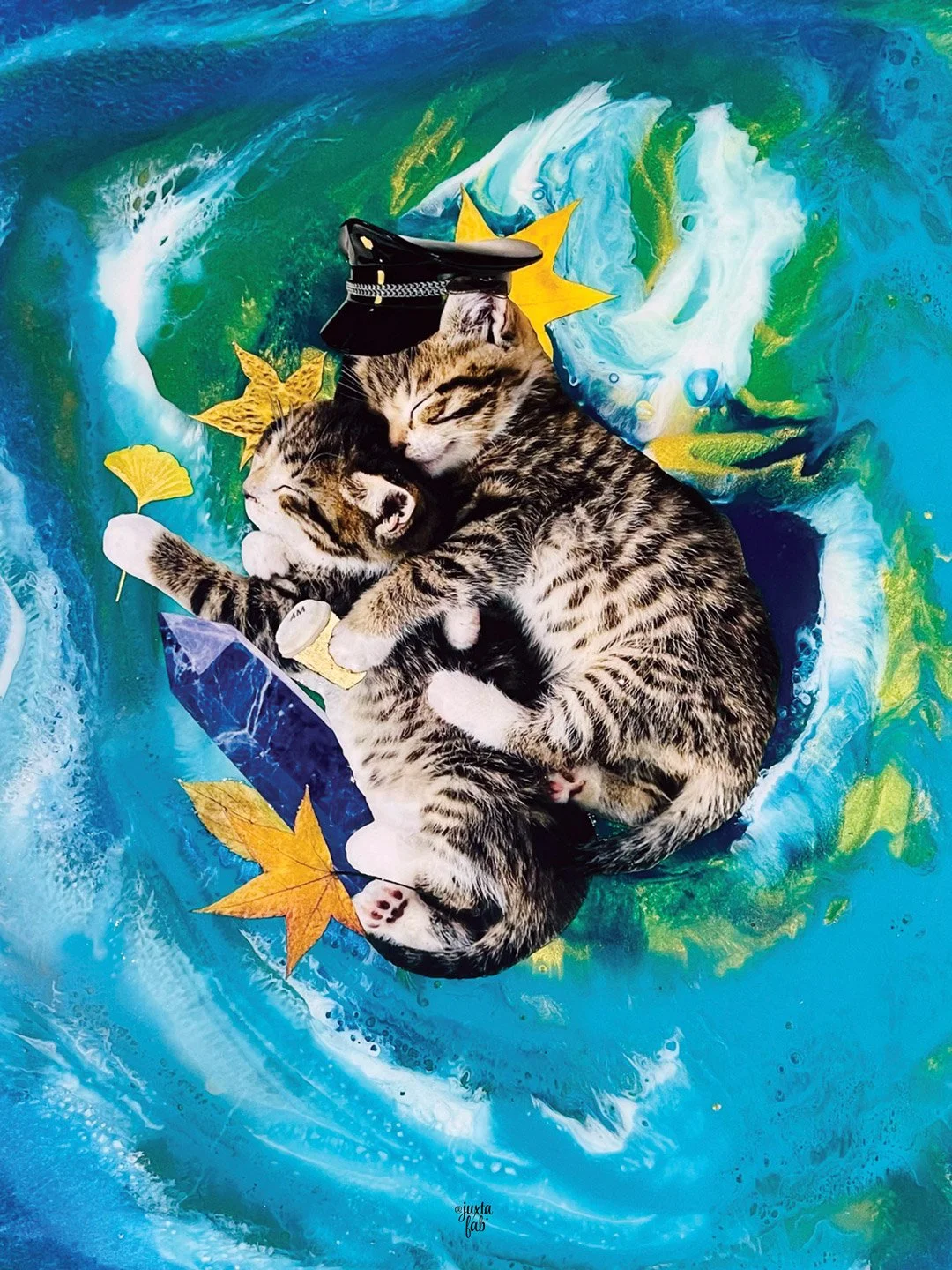 Two tabby cats cuddling on a colorful, swirling blue-green background with fall leaves. One cat wears a police hat, and the other holds a yellow fan. collage by Fabio Borges