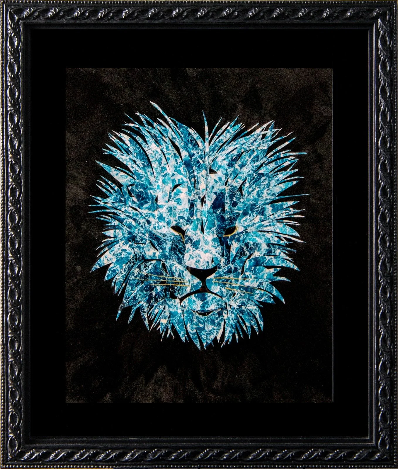 A framed artwork of a lion's head created with blue, white, and black textured patterns on a black background. collage by Fabio Borges - Cura Series