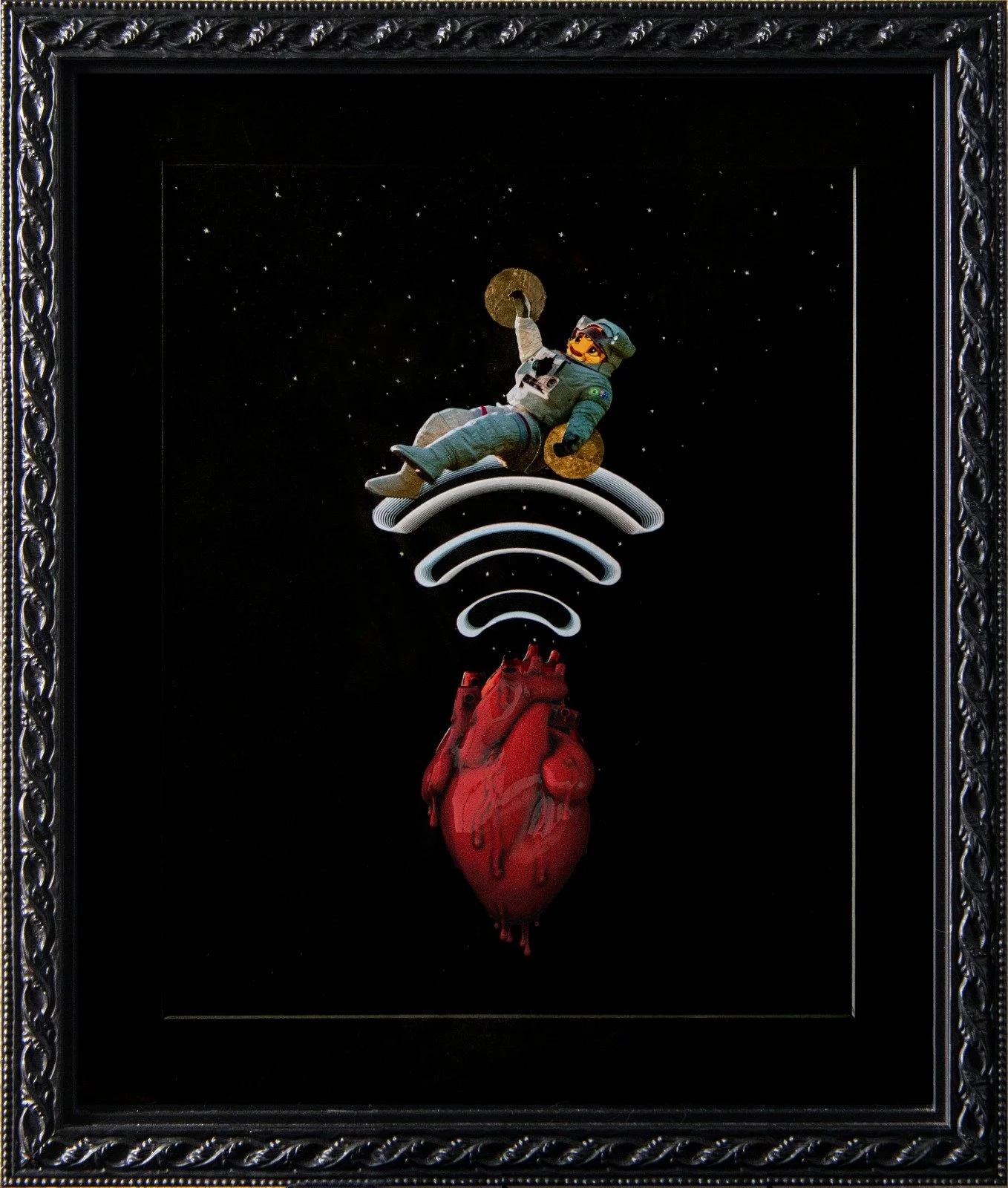 A framed artwork featuring a Lego astronaut figure riding a white rocket with a red anatomically detailed heart below, connected by Wi-Fi signal symbols against a starry black background. collage by Fabio Borges - Cura Series