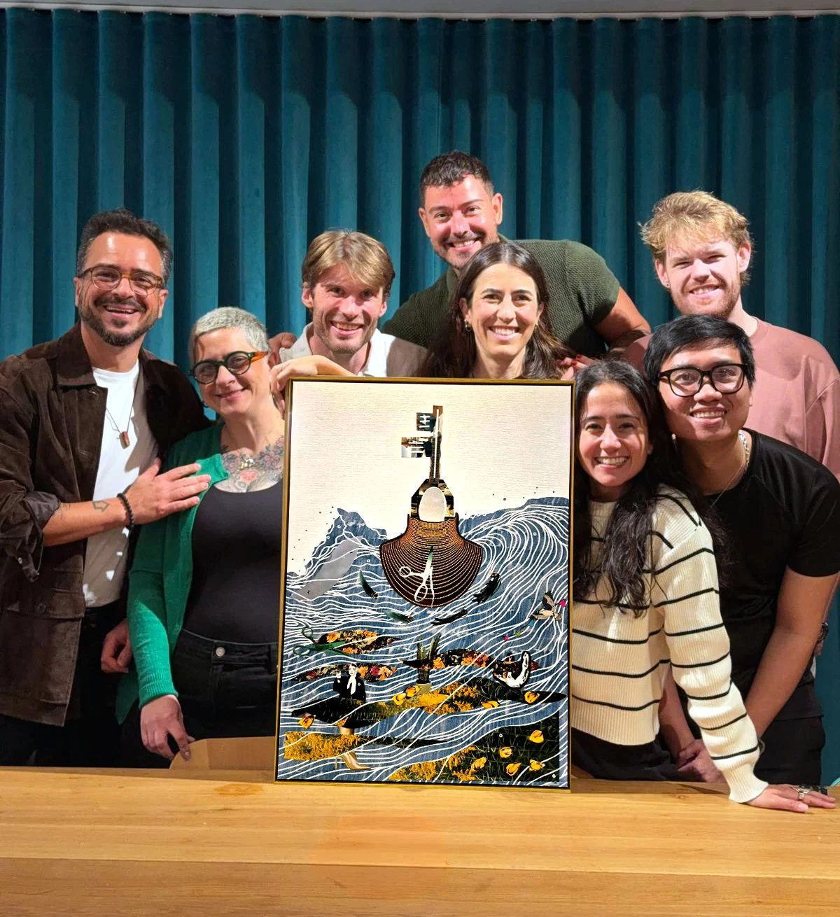 a group of people holding a collage artwork