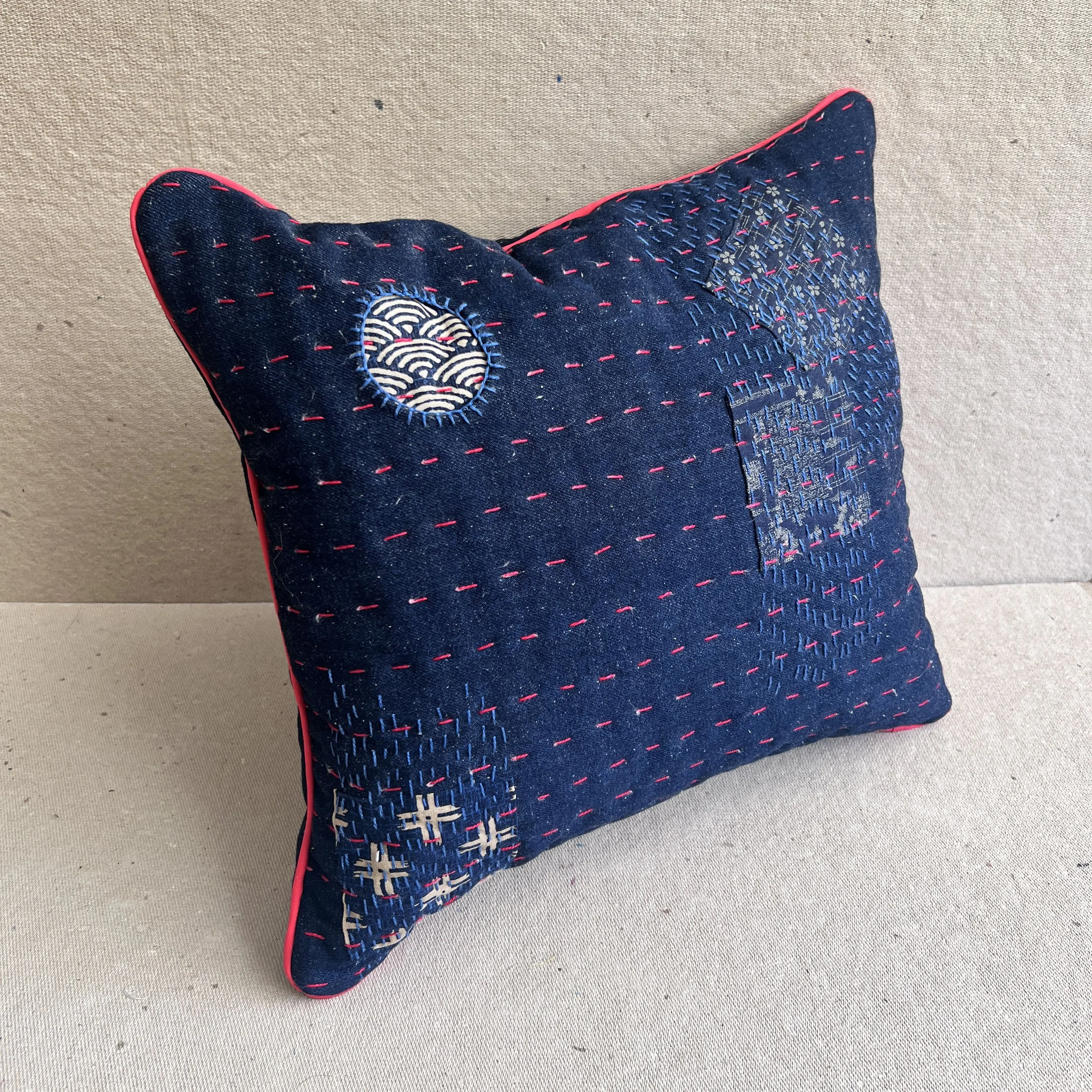 3/4 Front view hand embroidered pillow