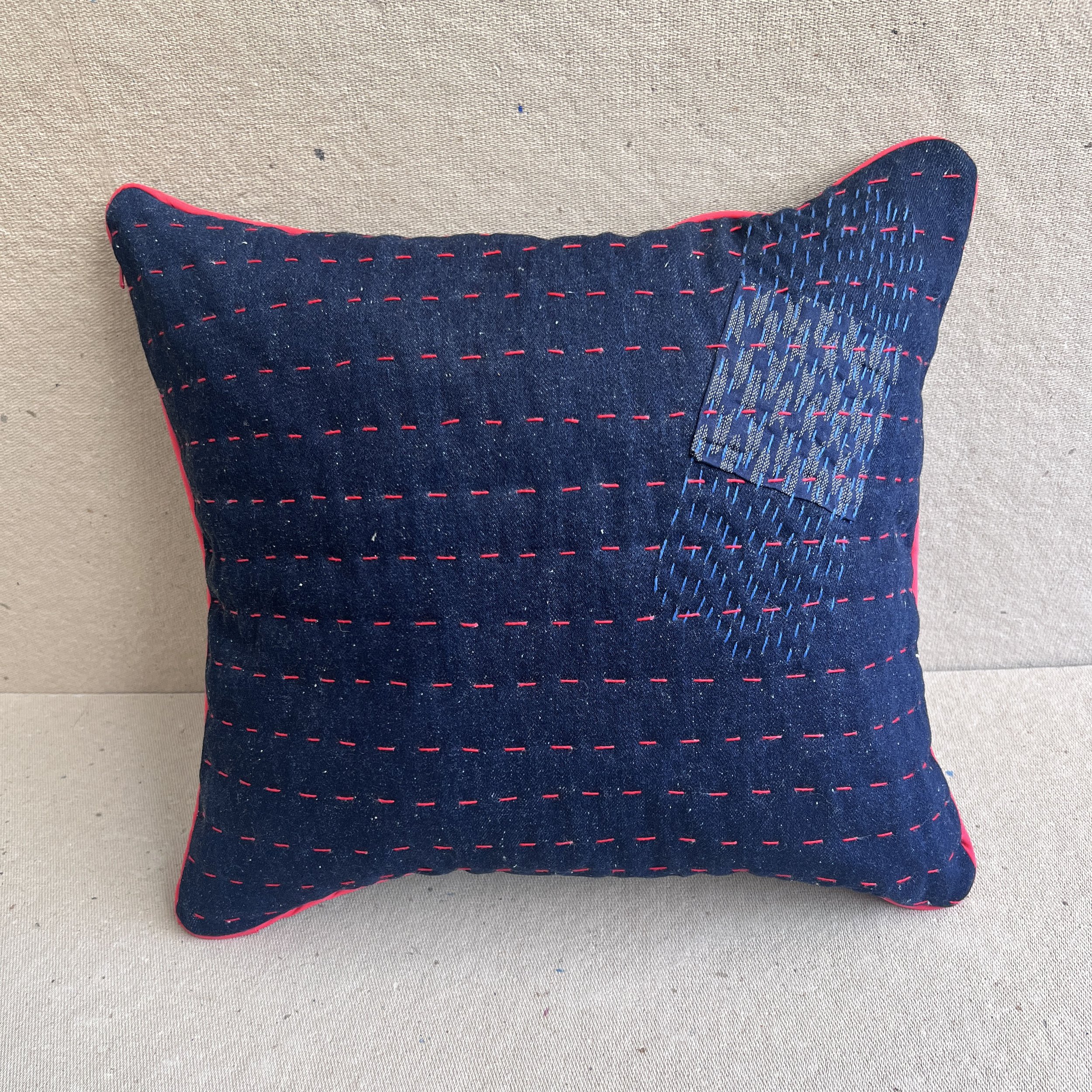 Back view hand embroidered pillow