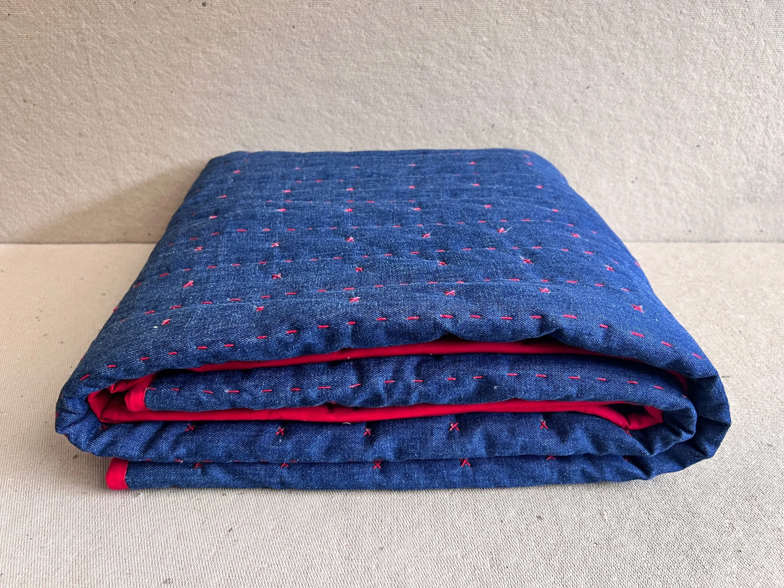 Hand embroidered blanket folded