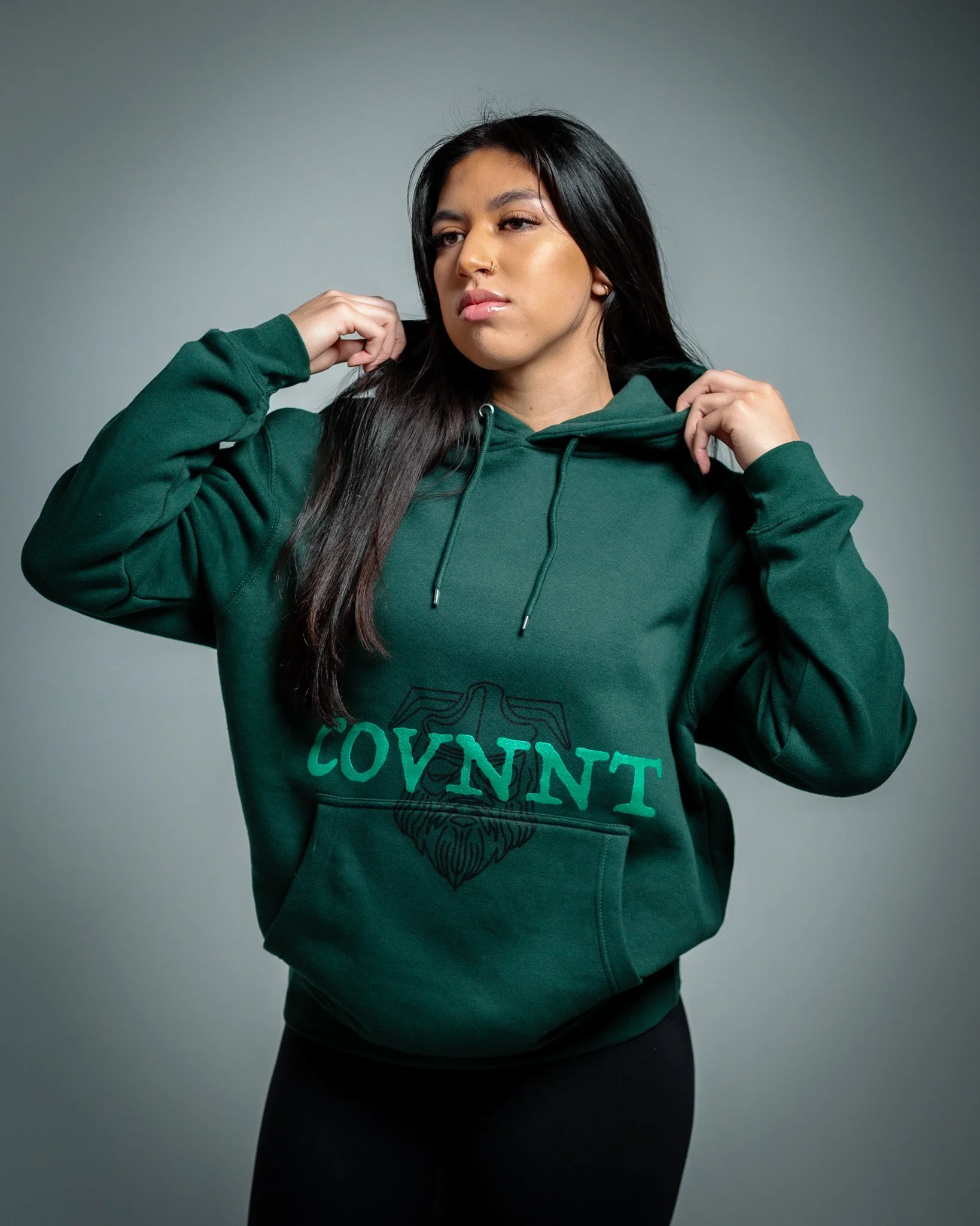 Female Model with Product Hoodie in studio