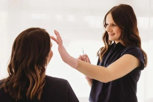 registered nurse injecting dermal filler and botox