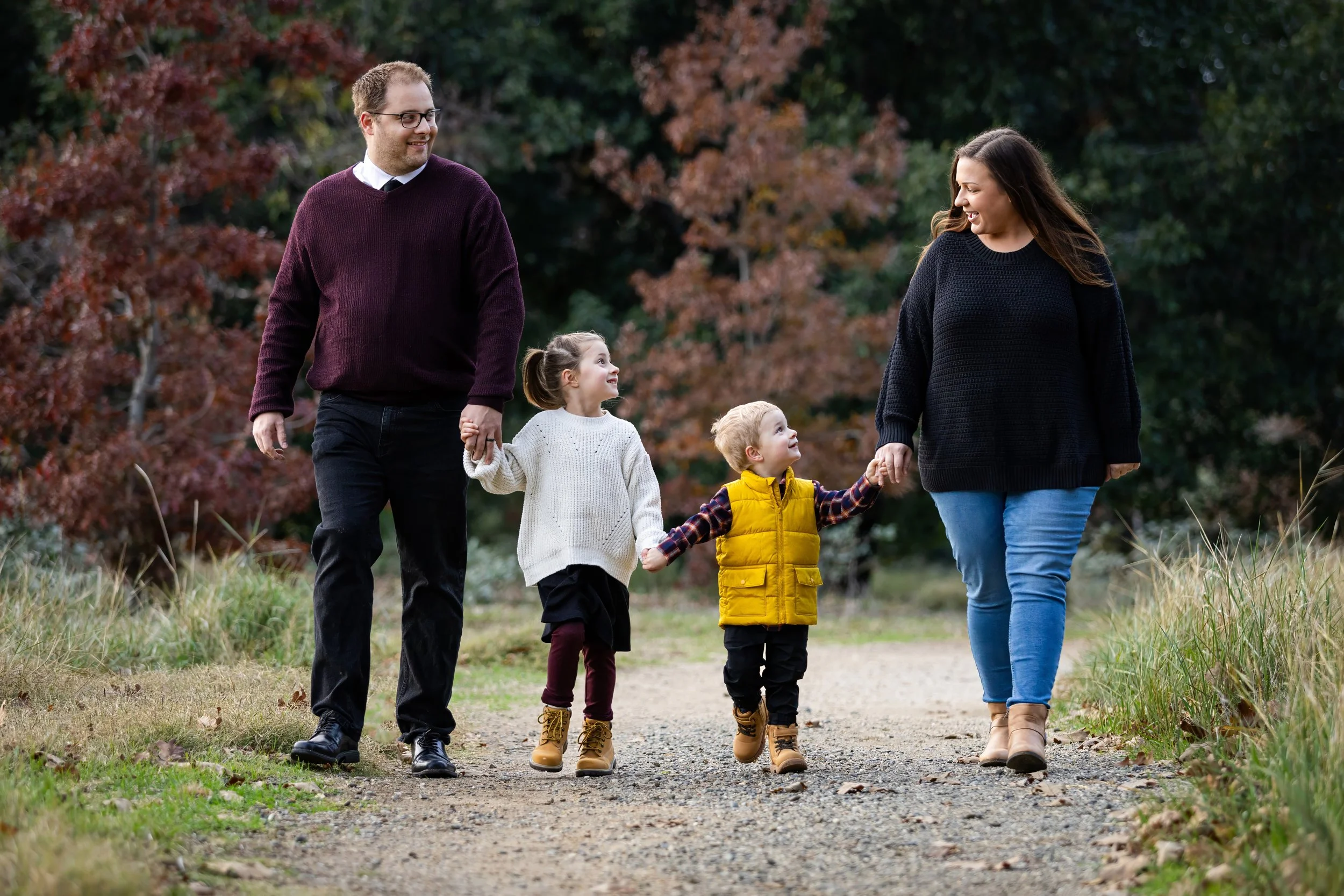 A Roseville Family walks at a local park. Photo taken by Roseville Family Photographer Kristina Geddert