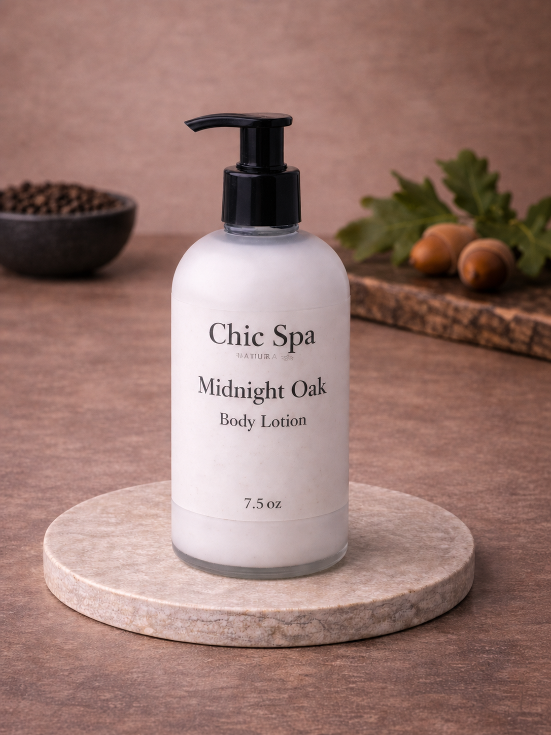 Chic Spa Naturals Midnight Oak Body Lotion in a frosted glass bottle with black pump on a stone display with warm earthy background styling.