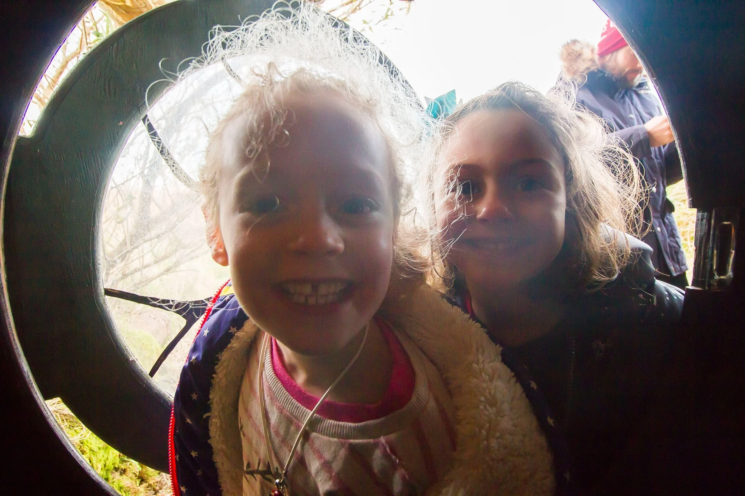Children smiling at the hobbit house