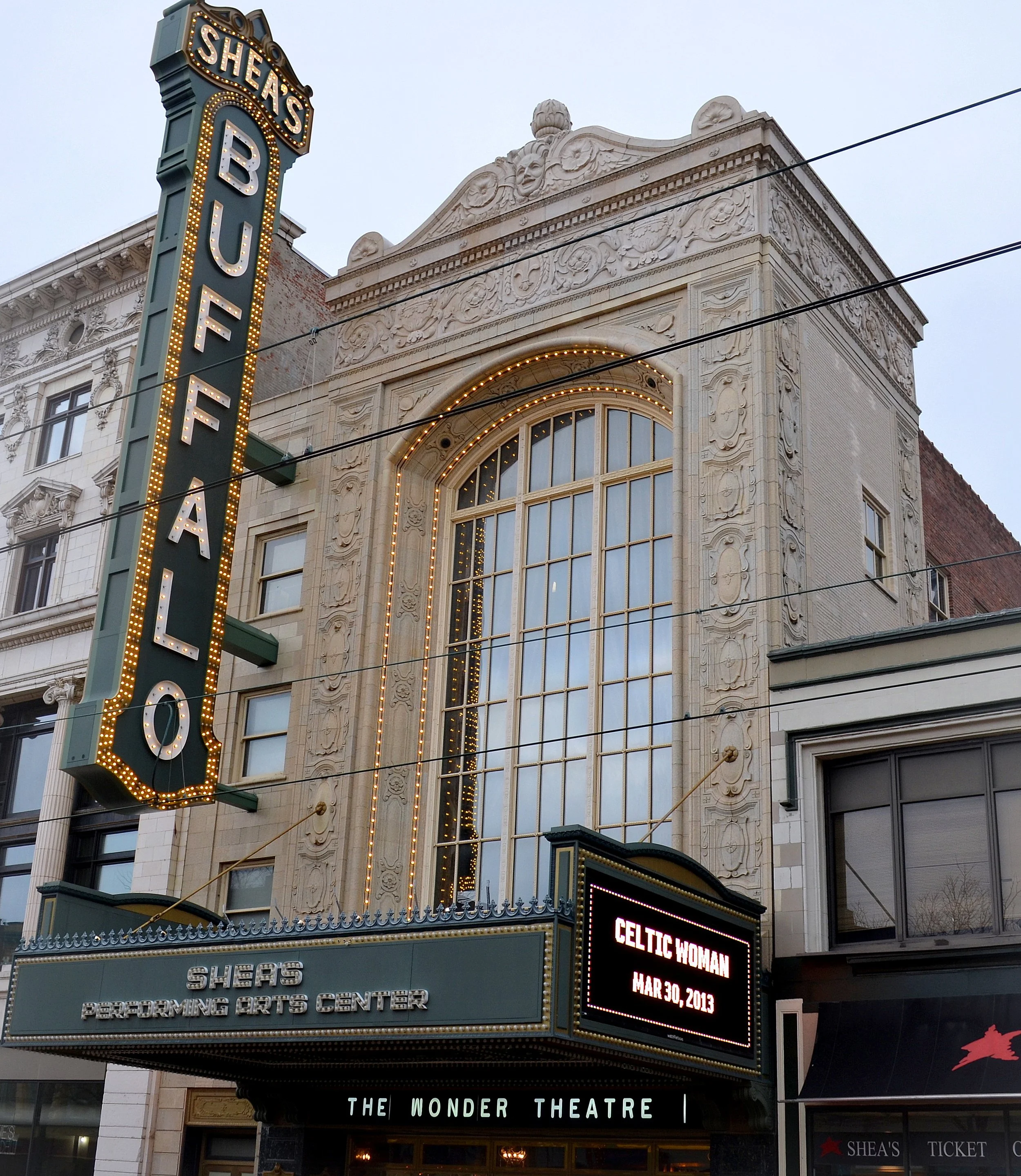 The Shear's Performing Arts Center marquee and theater entrance building with ornate architectural details, illuminated sign, and digital display. The theater hosts events like Celtic Woman on March 30, 2013, and features the Wonder Theatre.