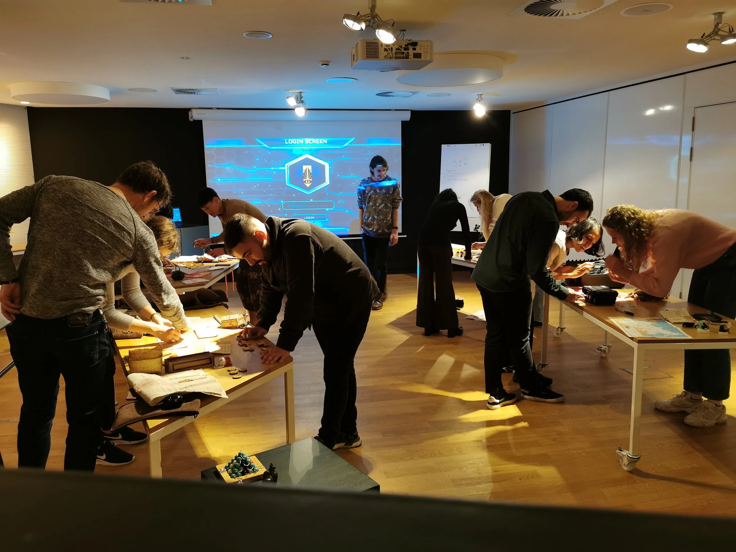 A team working on Time Crimes puzzles in their office, a perfect team collaboration exercise