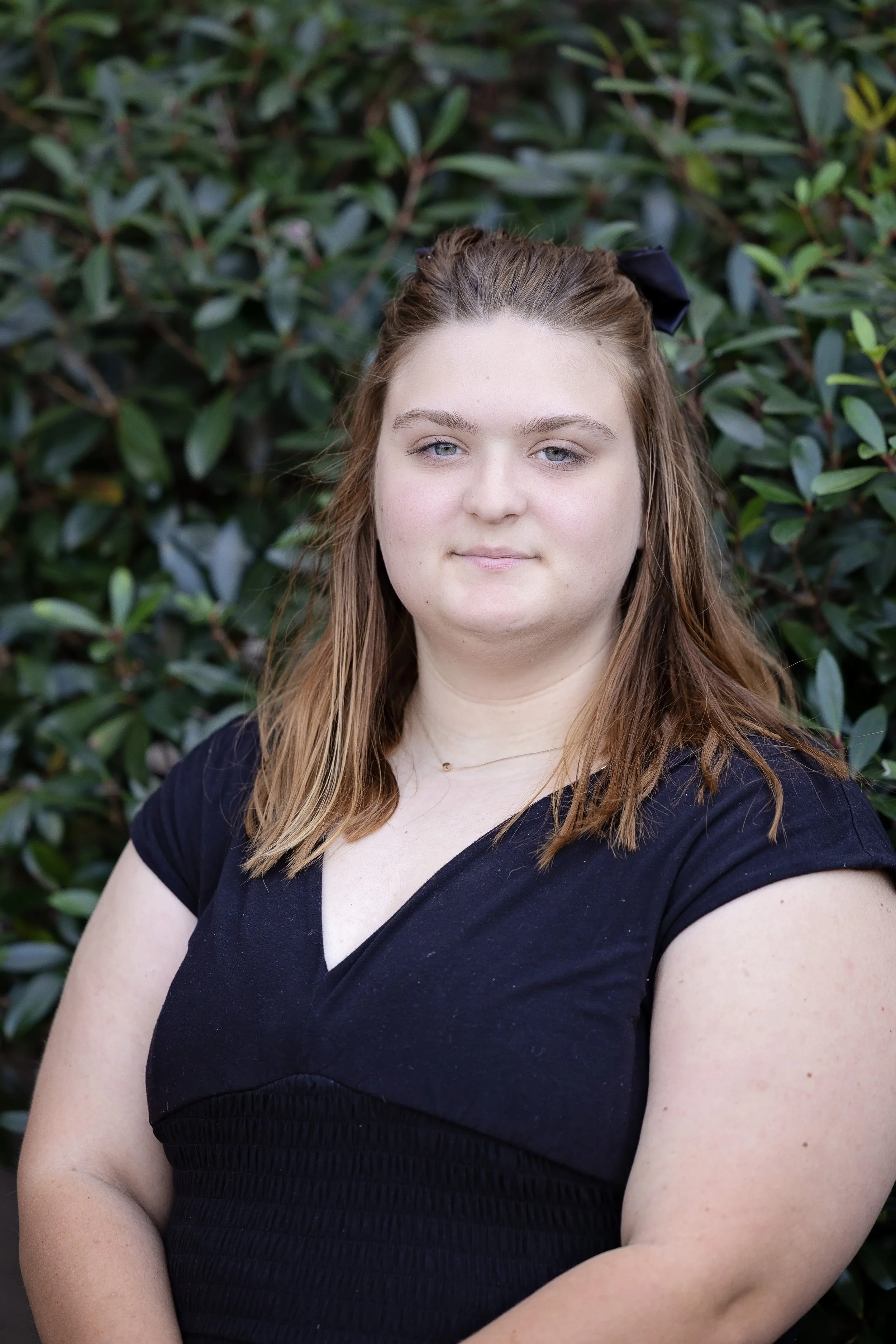 Logo of Point Christian Academy & Preschool featuring a stylized yellow number 2 with a white arrow inside, and the text 'POINT CHRISTIAN ACADEMY & PRESCHOOL' below.