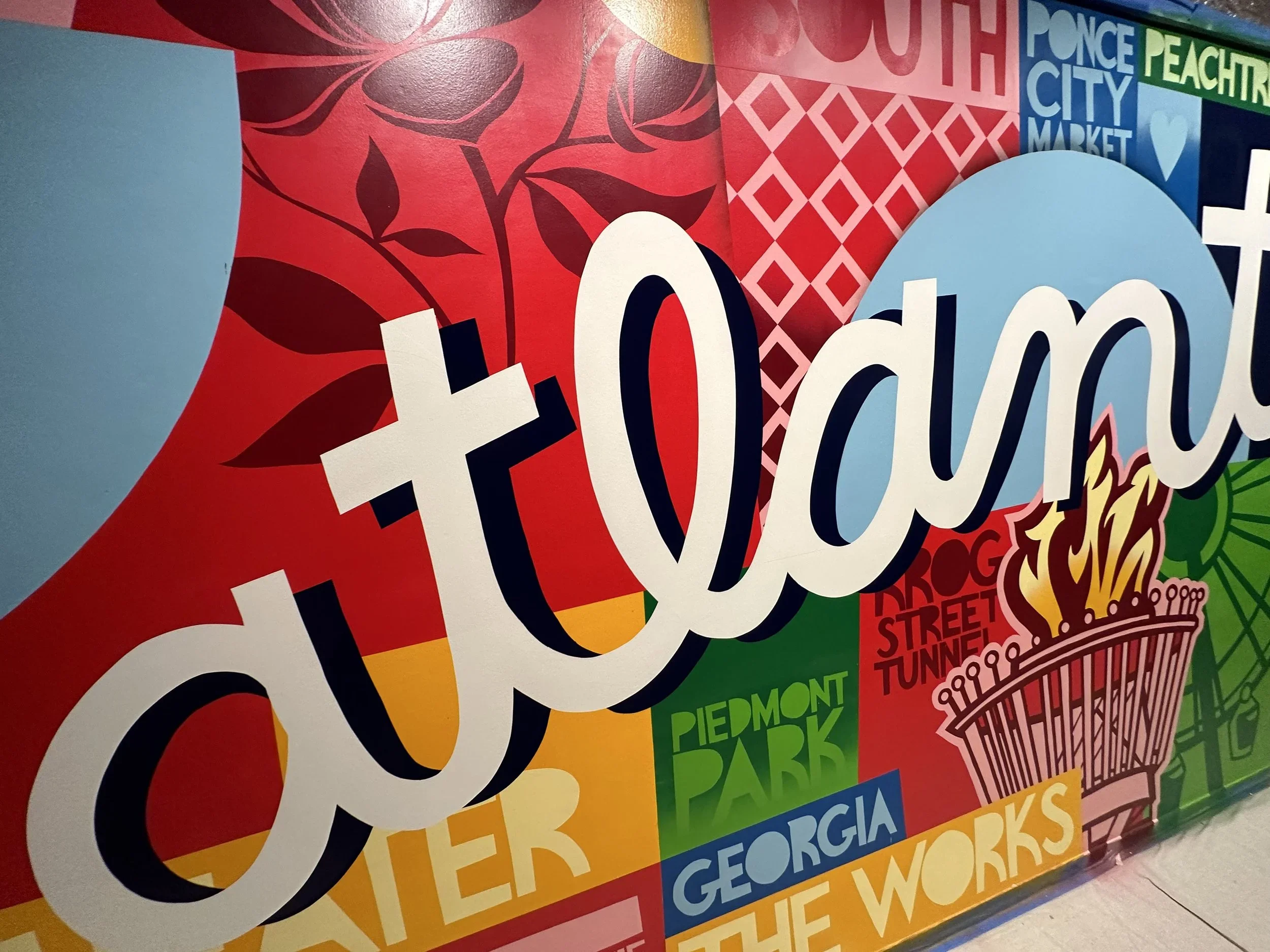 Close up view of Google Fiber mural by John Tindel showcasing Atlanta's history.