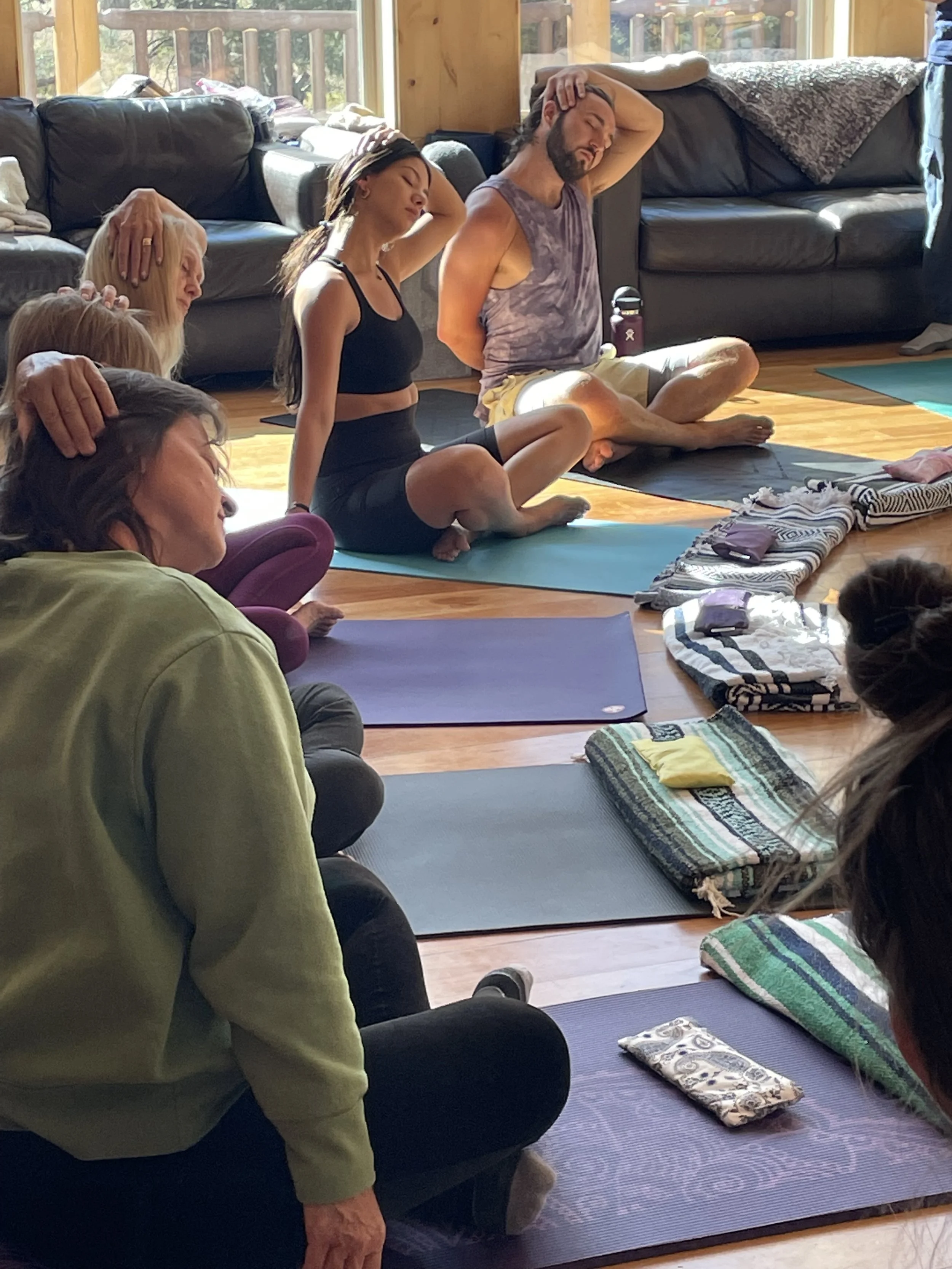 Revitallize and Harmonize yoga retreat students practicing morning yoga.