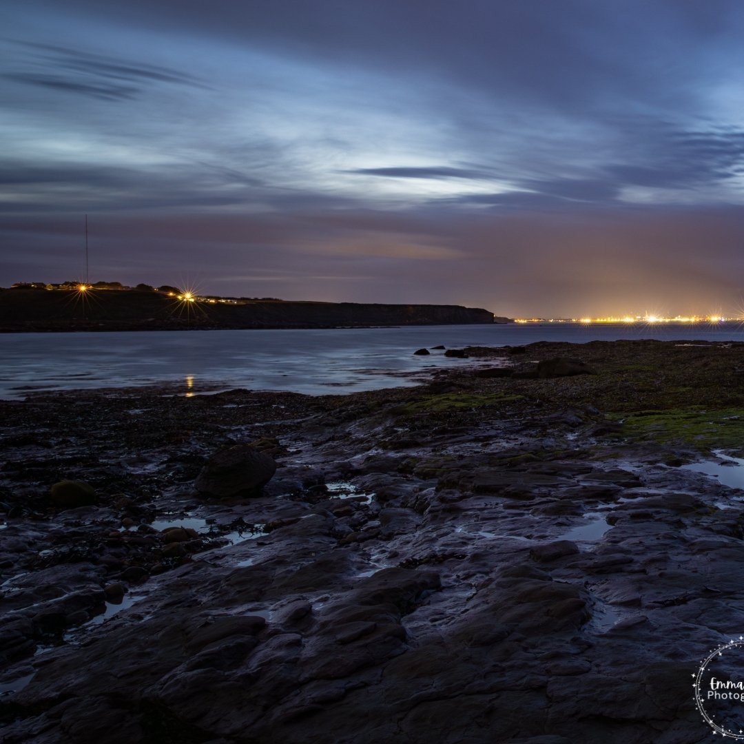 L O O K I N G  N O R T H

Instead of the usual view of St Mary's Lighthouse, I turned north to capture something different. This photo shows the last glow of sunset set against the bright lights of Blyth Shipyard.

The wooden pillars naturally draw y