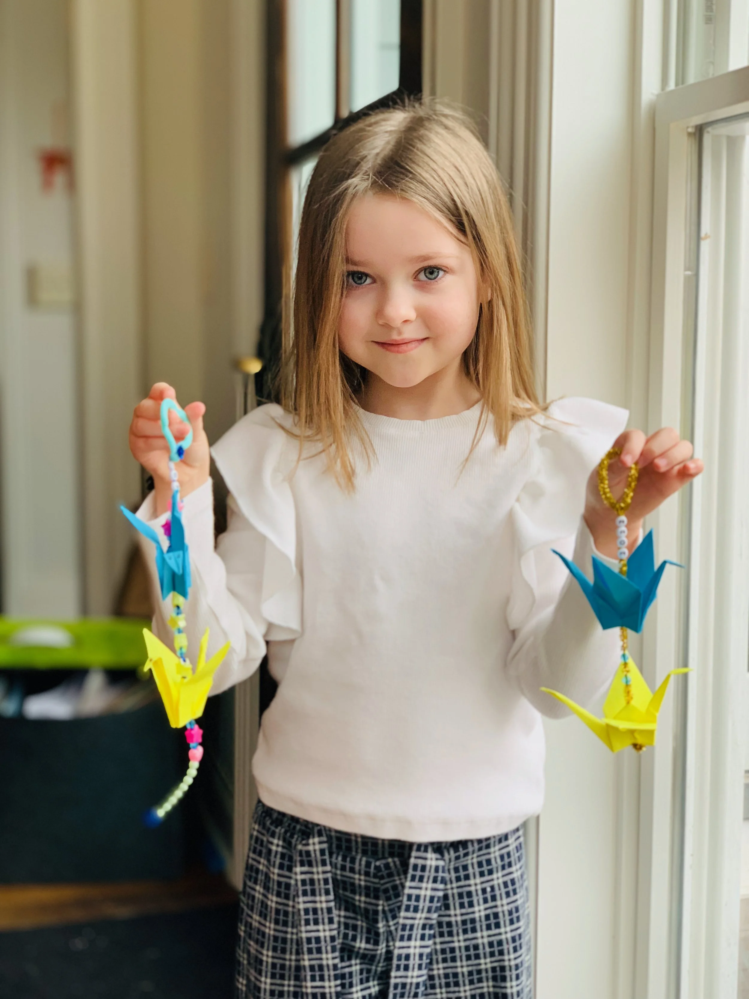 Girl with origami cranes