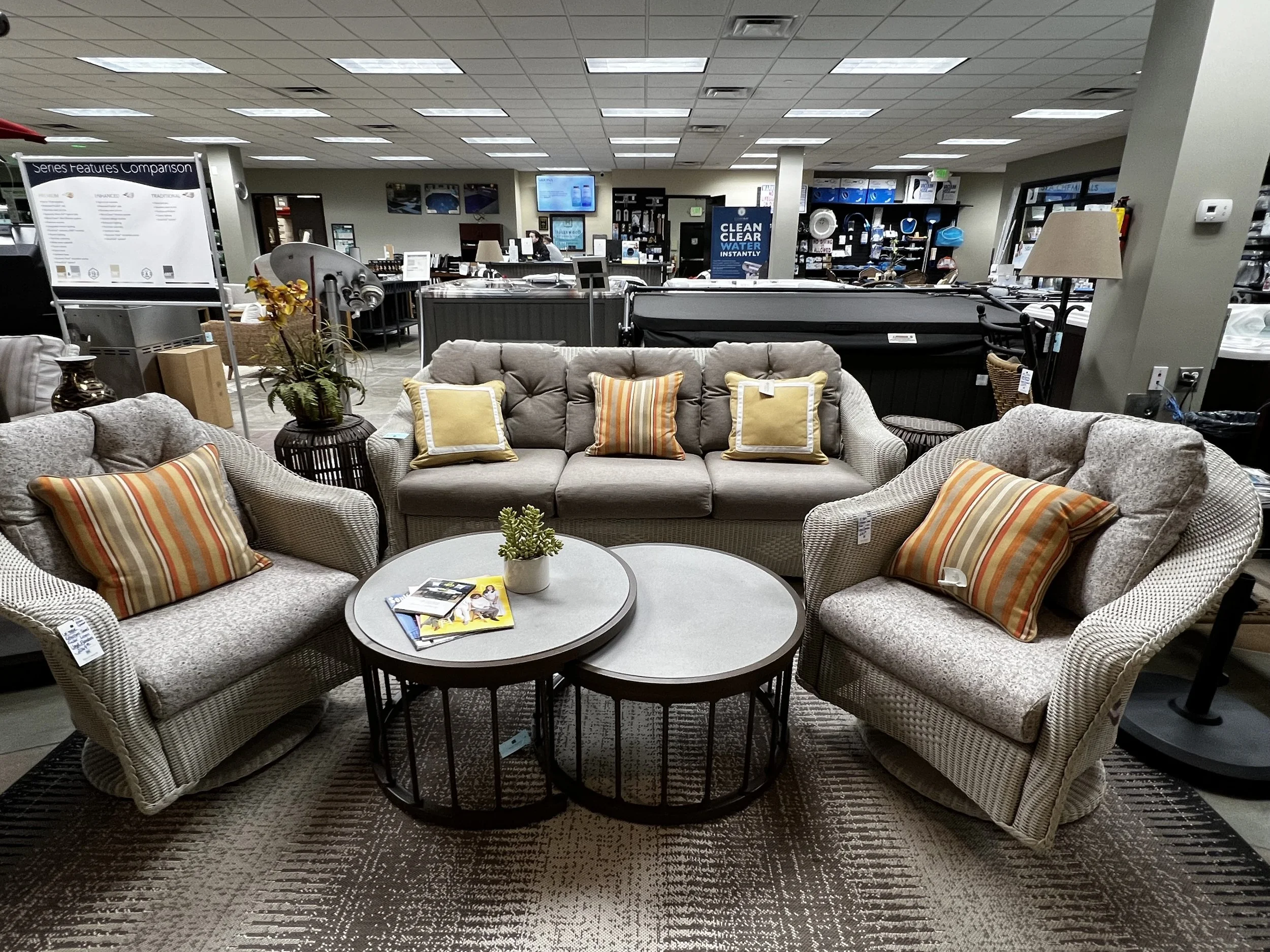 Grey outdoor furniture set with nesting tables in Hollywood Outdoor Living's store