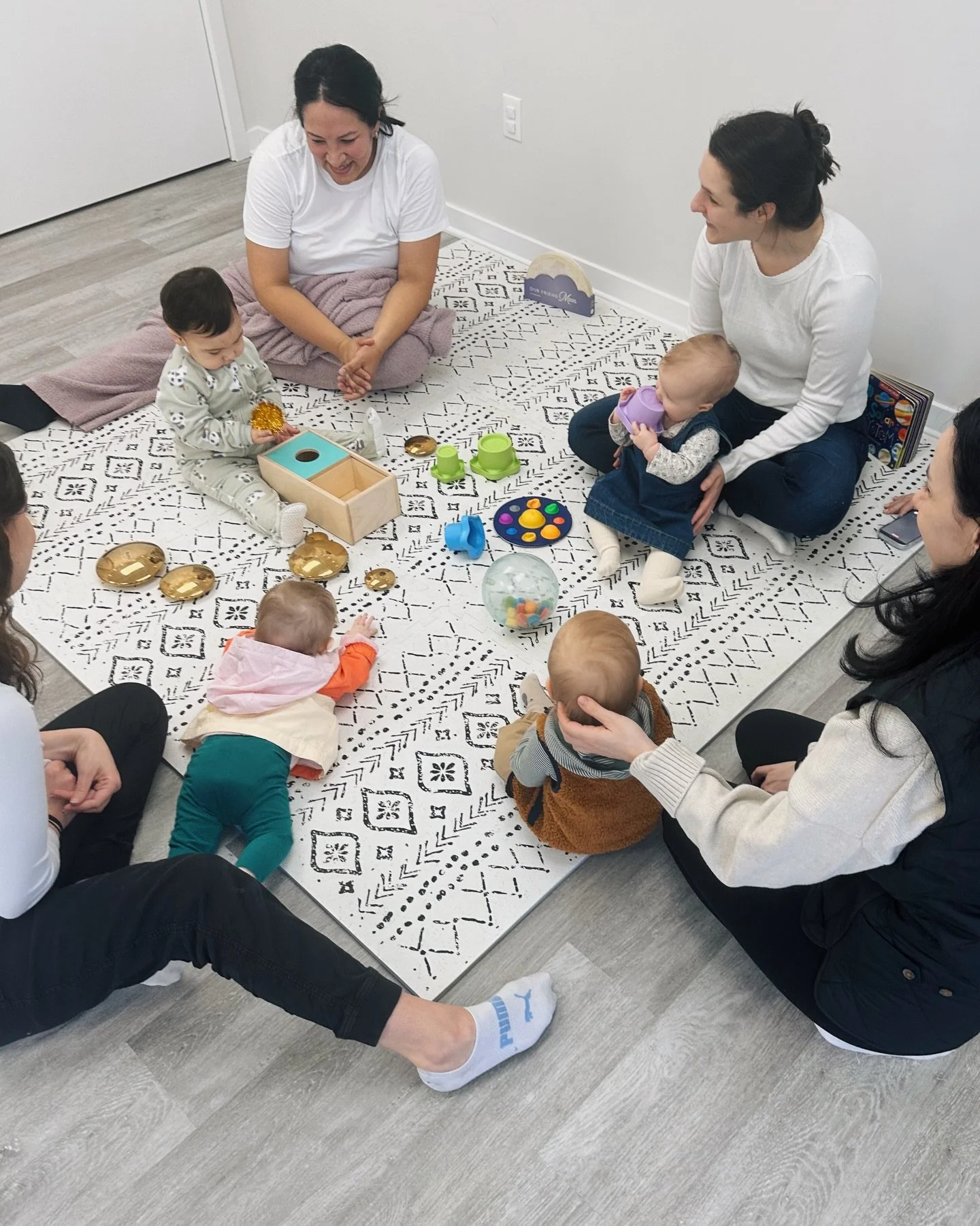 The sweetest part?
The babies are making friends too. 🥹

Week after week they see the same little faces &mdash; crawling closer, sharing toys, studying each other with curious eyes.

While parents connect, something special is happening on the mat t