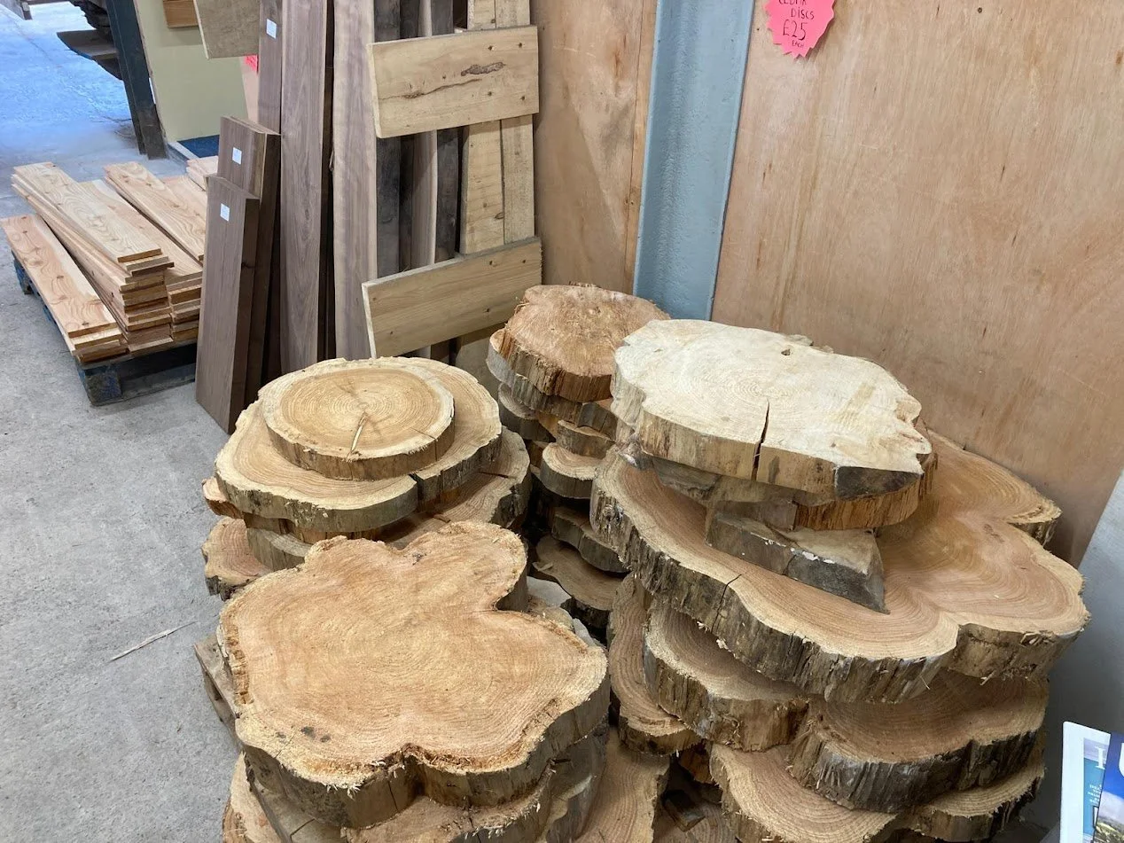 Larch + Walnut + cedar rounds in shop.JPG
