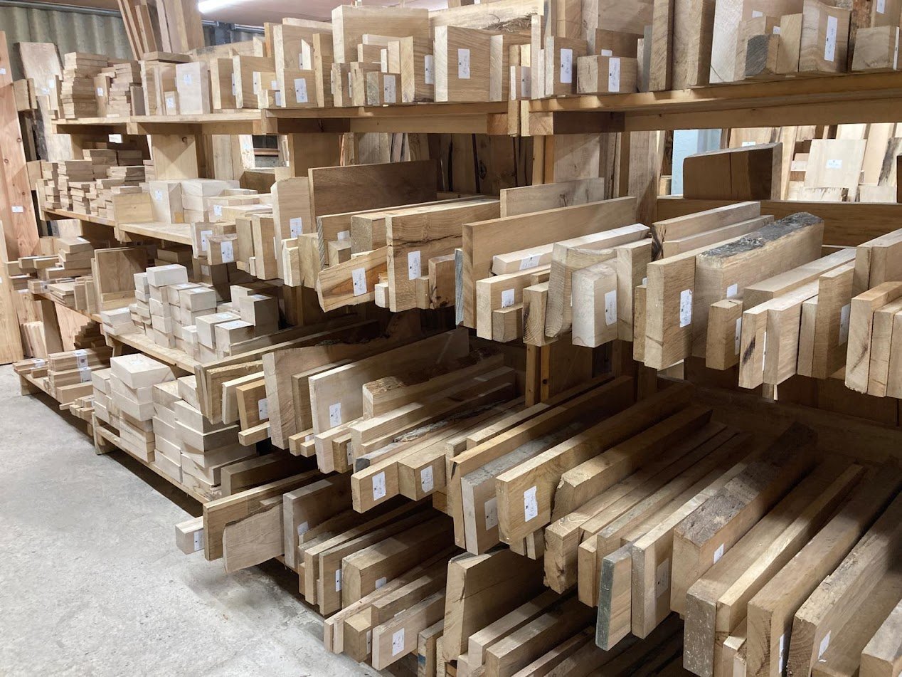 Small boards and woodturning racks in shop.JPG