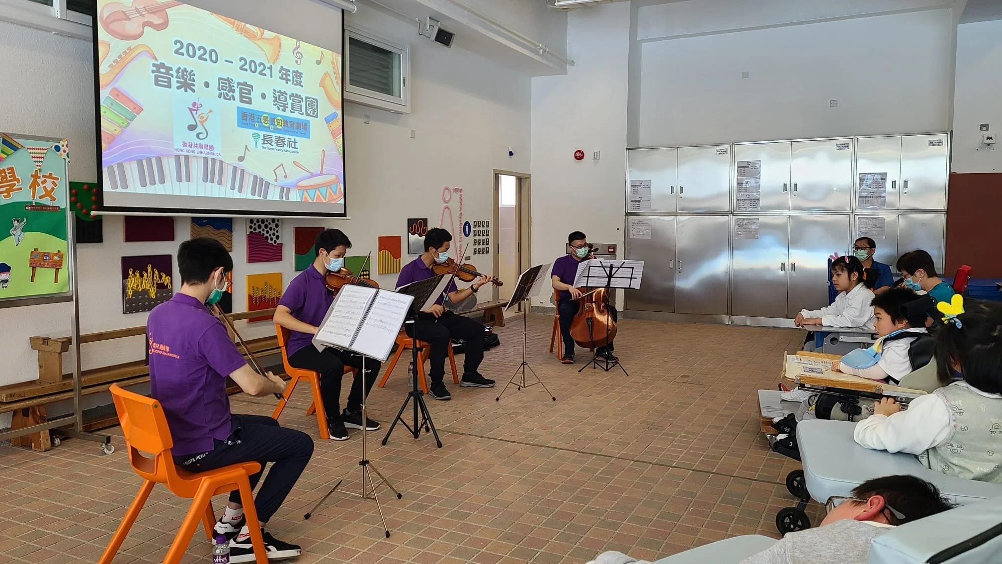 Hong Kong Enharmonica musicians playing many different pieces in their program