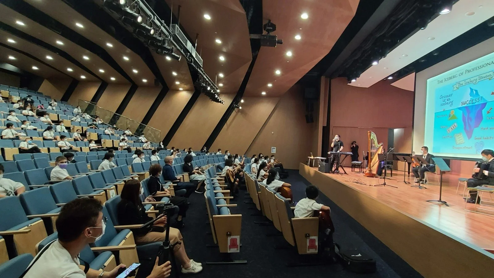 Students listening attentively to the performance