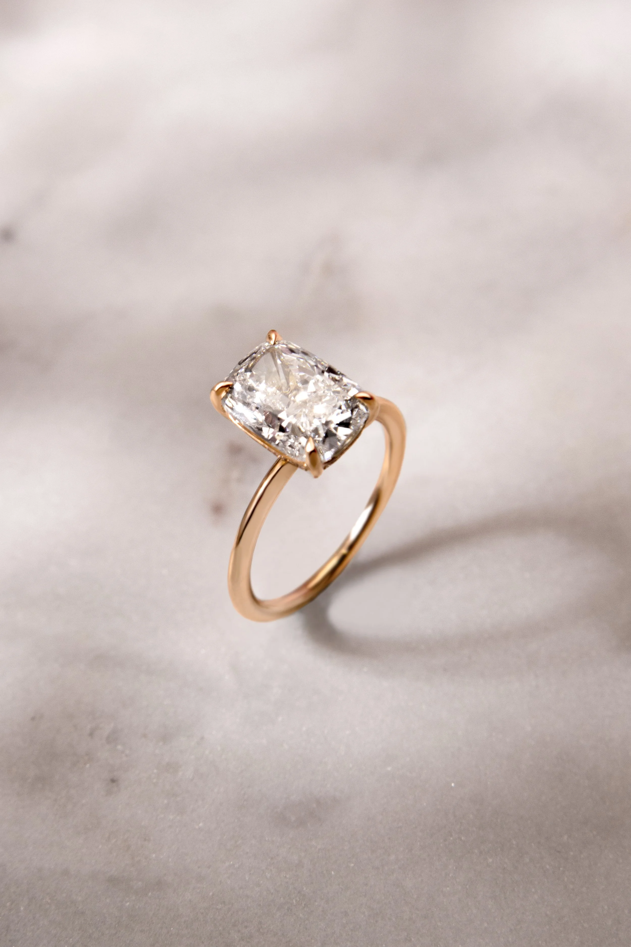 18K yellow gold ring by Sophie Cudworth set with 3ct cushion cut diamond 