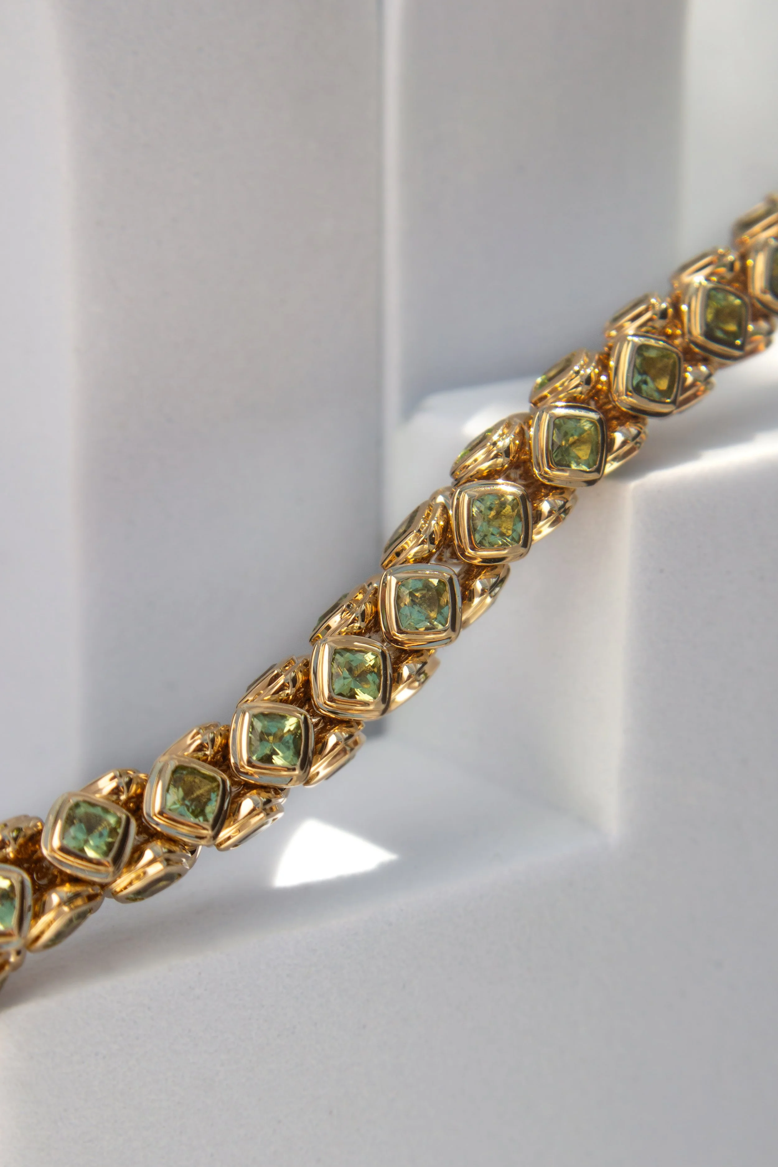 18K Yellow gold award winning necklace design, set with Fuli peridot gemstone by Sophie Cudworth