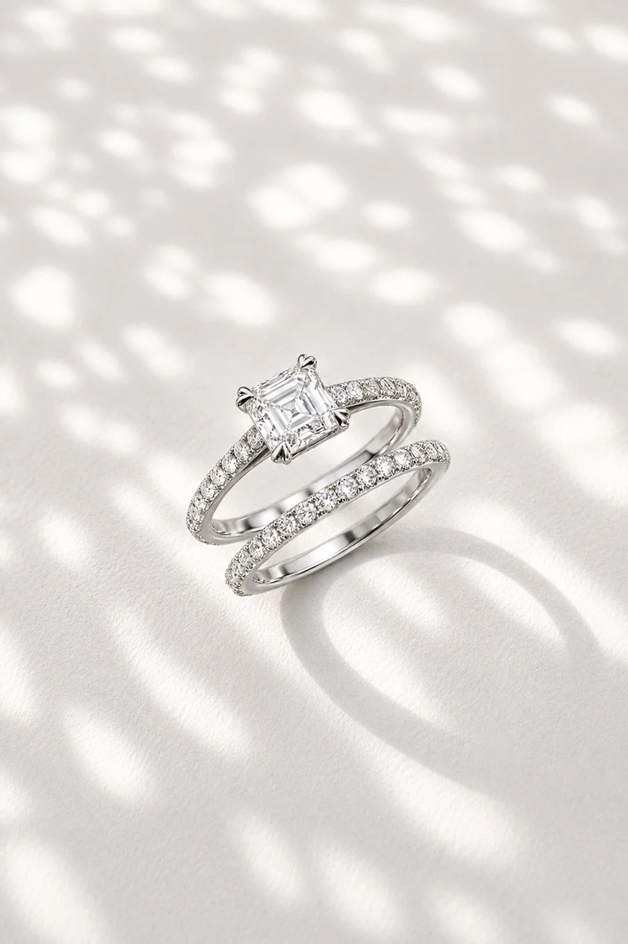 Platinum with 1ct asscher cut natural diamond D VS1 with diamond set shoulders and matching wedding band 