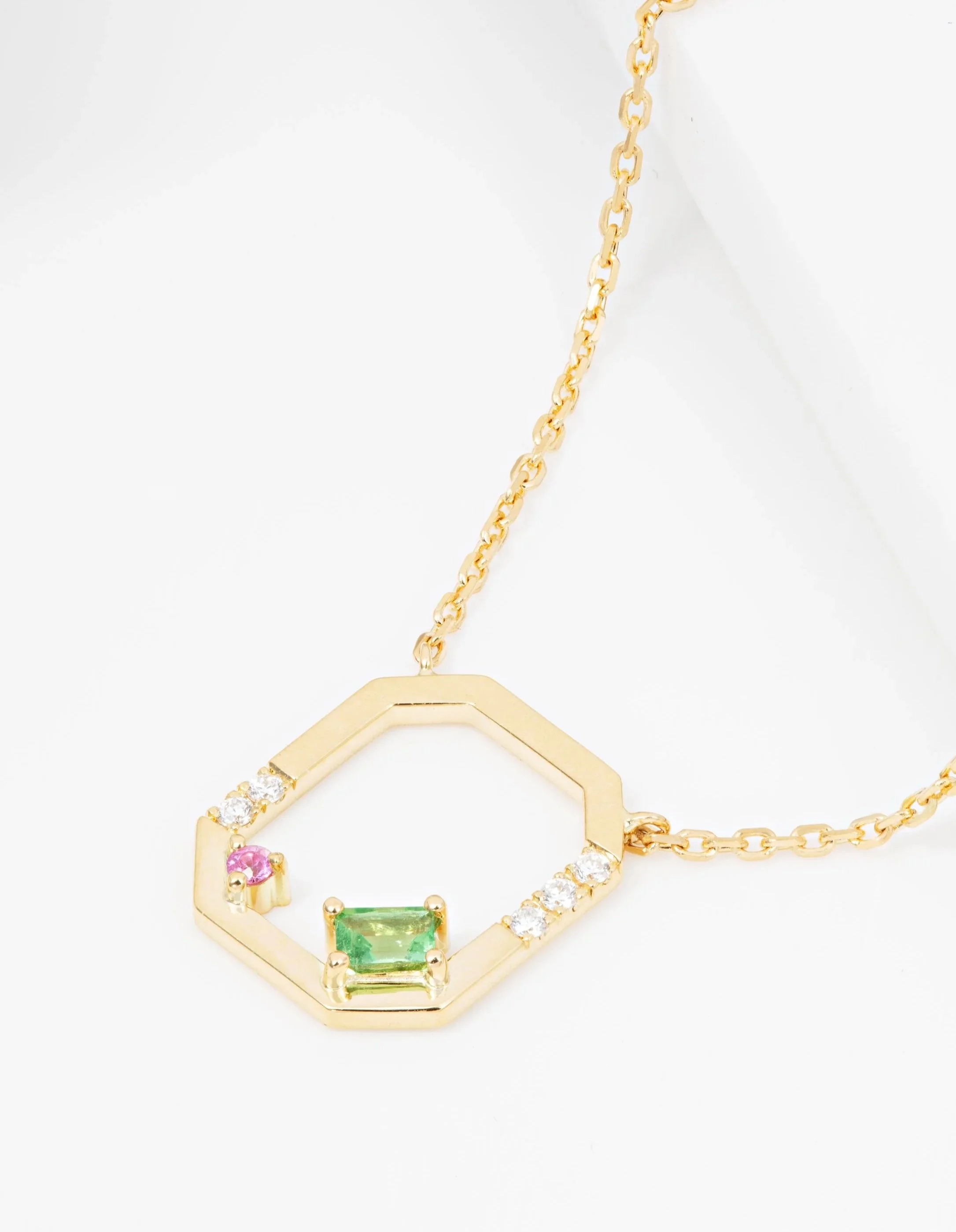 Collier en or jaune 18 carats sertie d'un grenat tavorite, d'un saphir rose et de diamants - disponible en boutique
