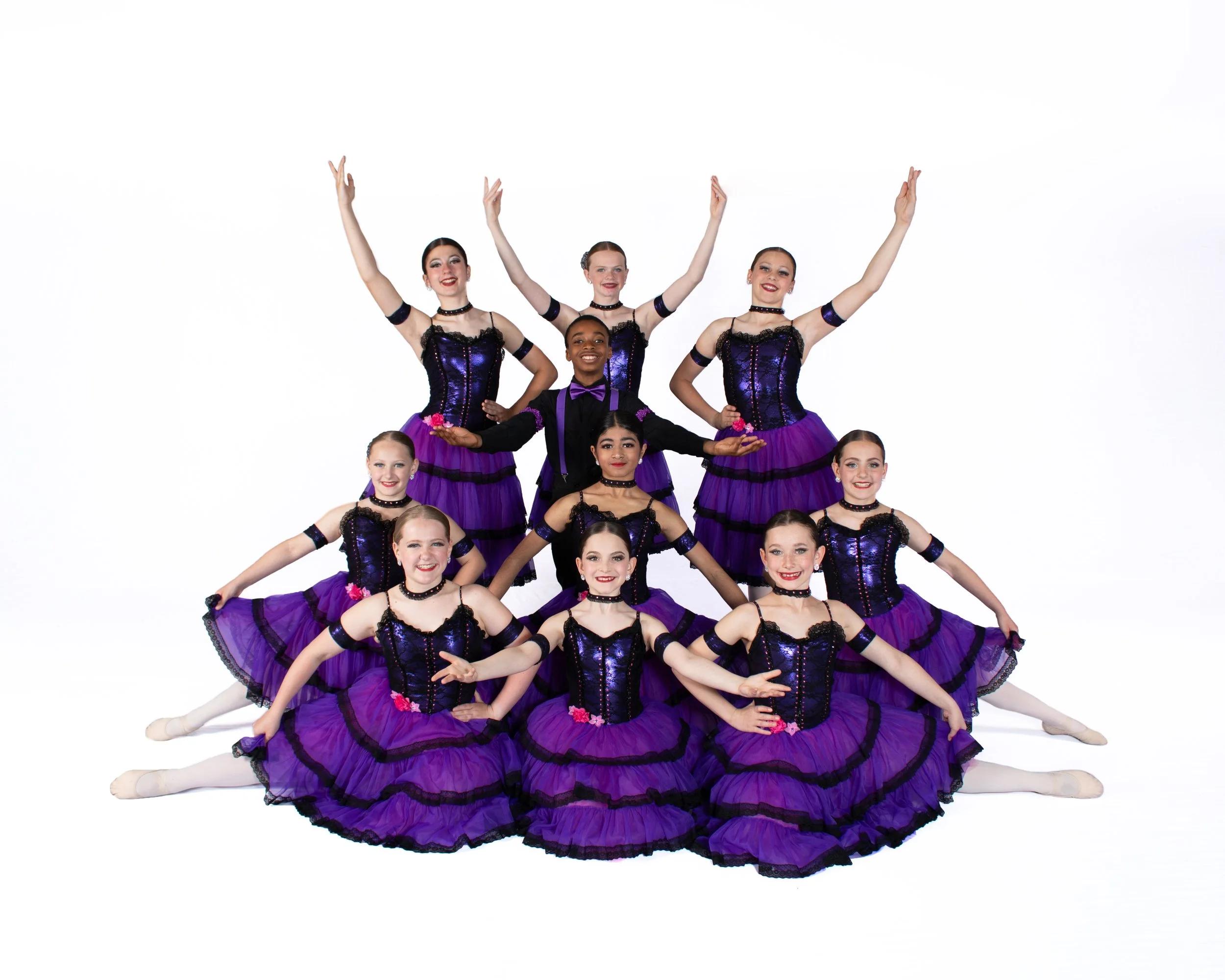 Junior Company dancers in matching green costumes