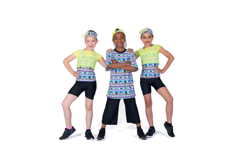 Three young hip hop dancers in colourful costumes