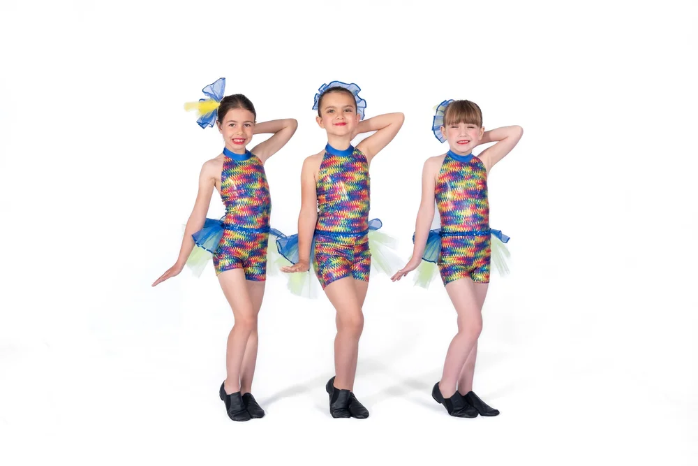 Three Dynamite Dancers in matching jazz and tap costumes