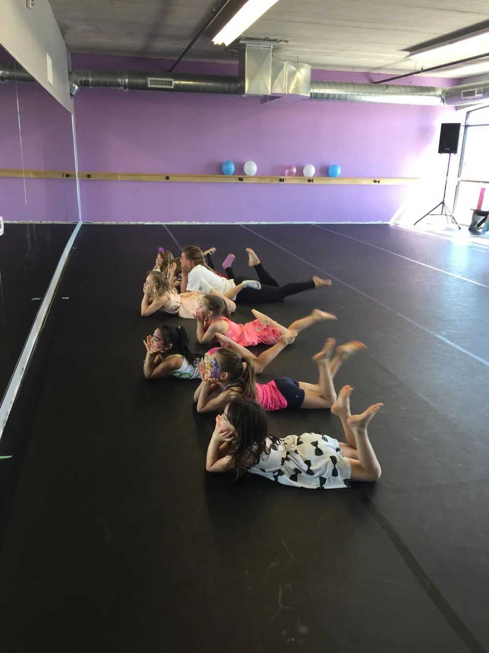 Children enjoying a dance party activity in the studio