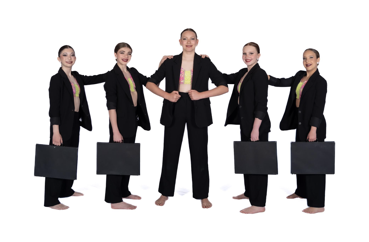 Teen jazz dancers in black performance costumes