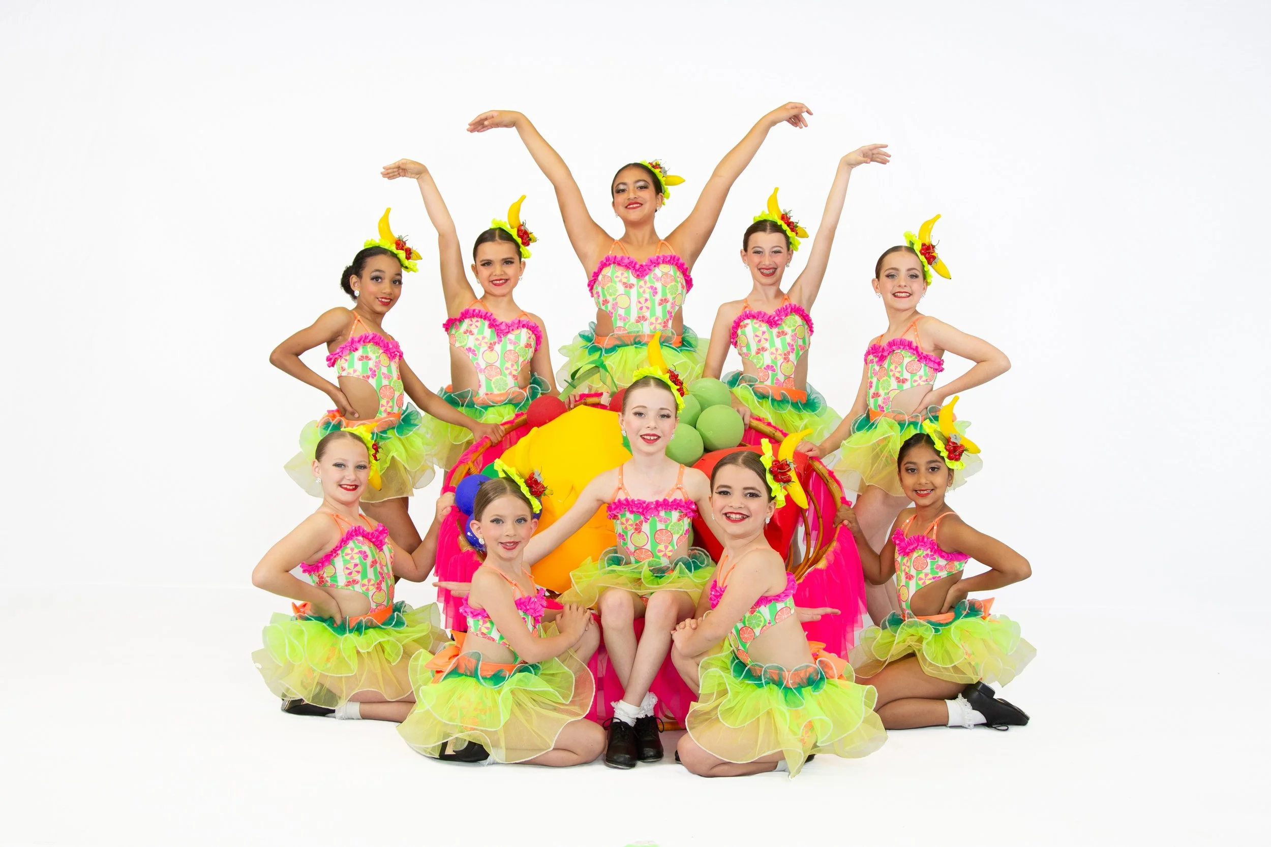 Mini Company dancers in coordinated performance costumes