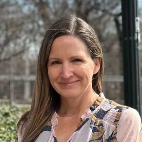 smiling caucasian woman brown long hair outside