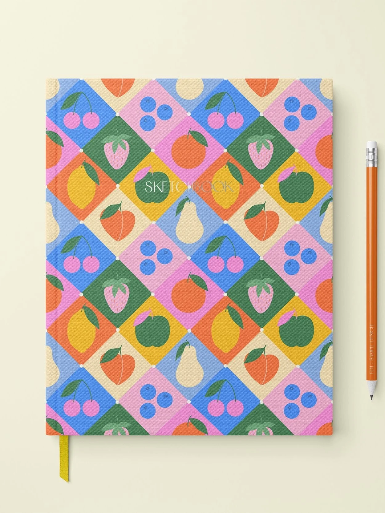 Colourful notebook cover with a fruit pattern including cherries, blueberries, strawberries, oranges, pears, apples, and lemons in a diamond grid design.