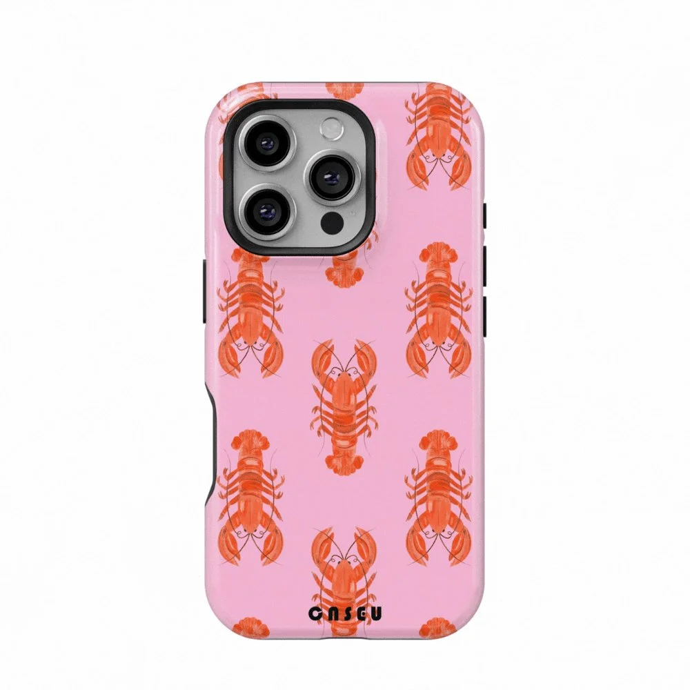Pink phone case with a pattern of red lobsters and a black logo at the bottom.
