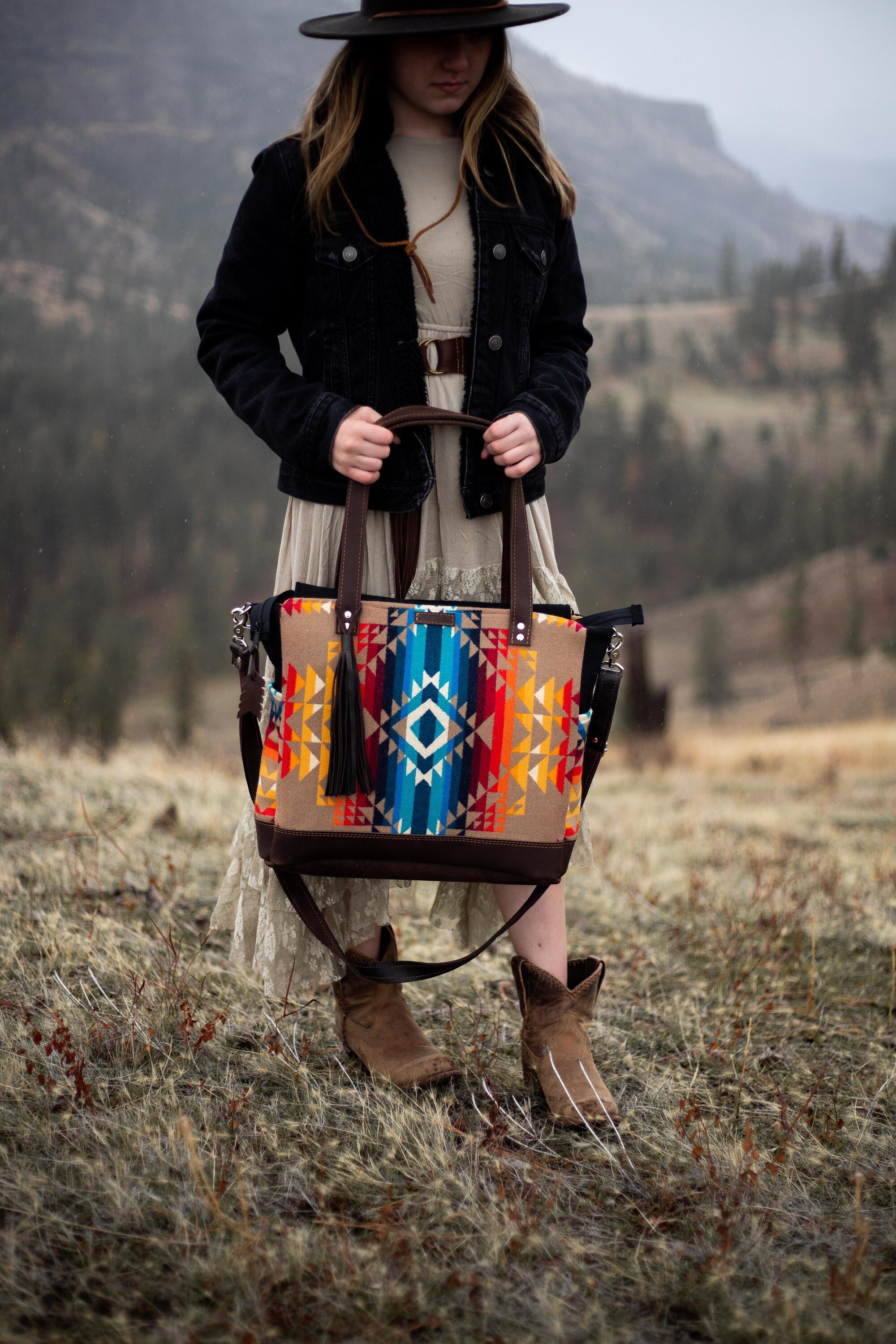 woman holding a large back pack tote Made with Pilot Rock Pendleton Wool and Brown Leather on a ranch