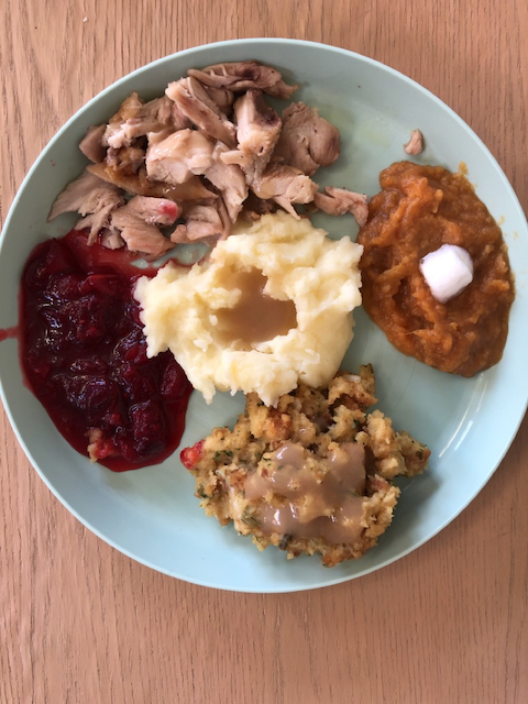 Thanksgiving turkey, stuffing, sweet potatoes, mashed potatoes and gravy and homemade cranberry sauce