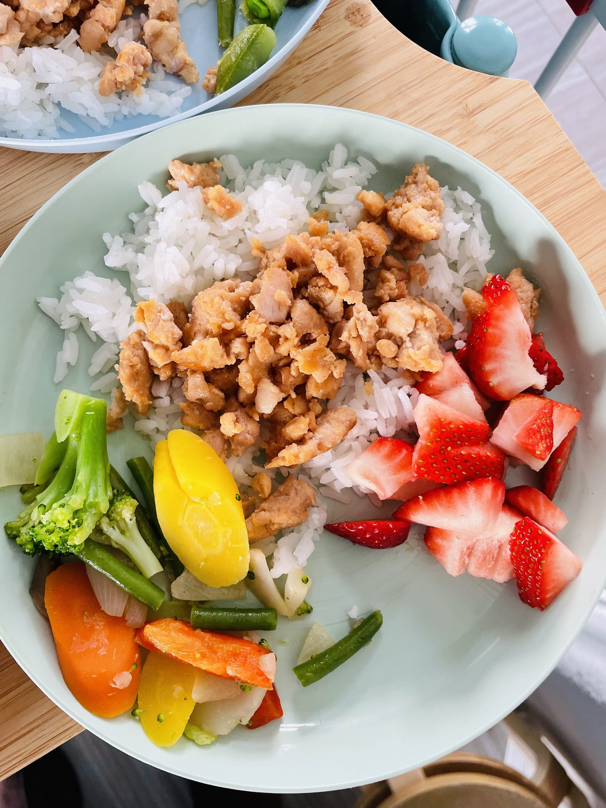 Teriyaki salmon, rice, mixed veggies and fresh strawberries.