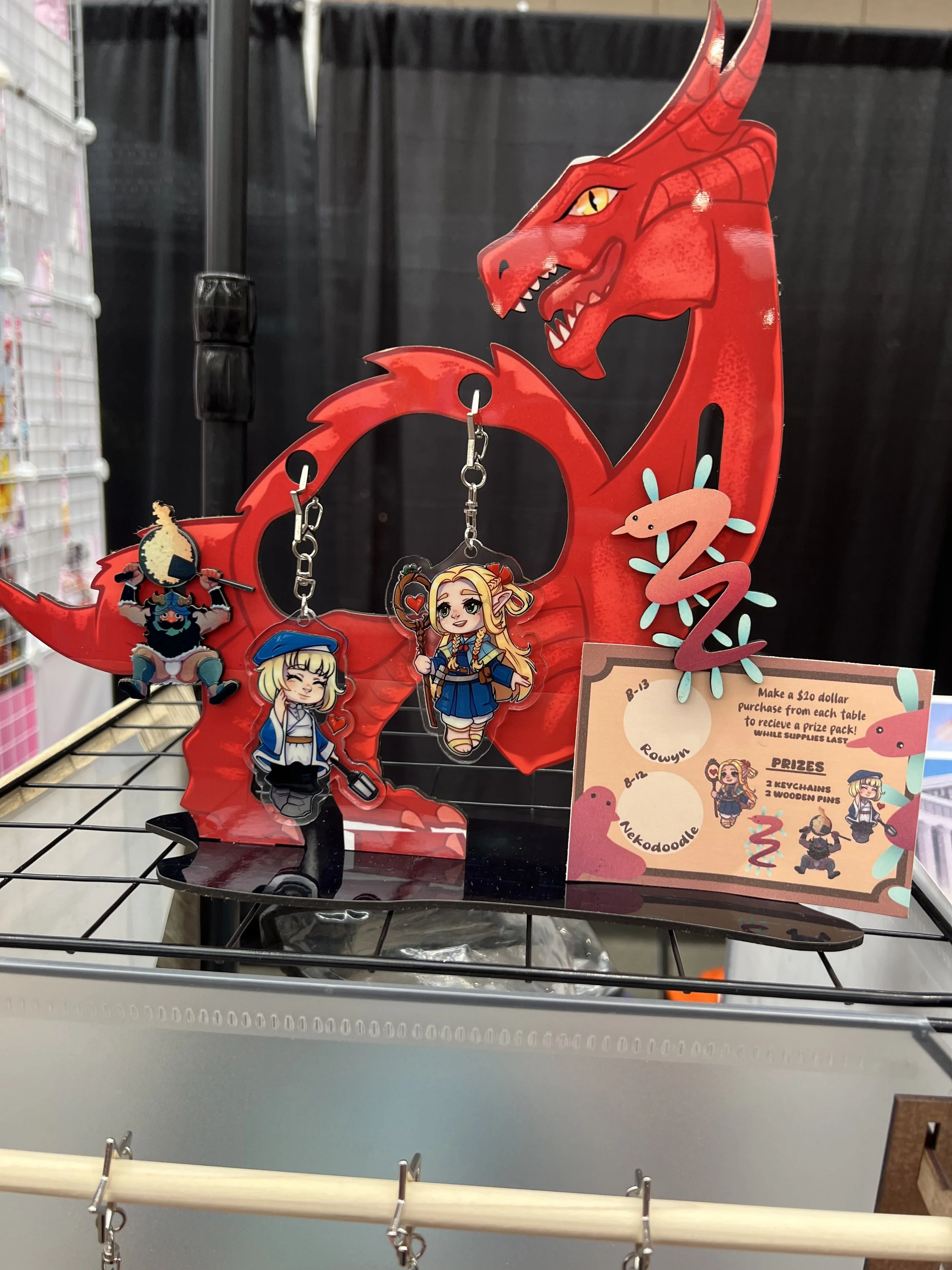 This display does have two keychains that are not my design, but were used as display purposes, that artist is nekodoodles for the Marcelle and Falin keychains!