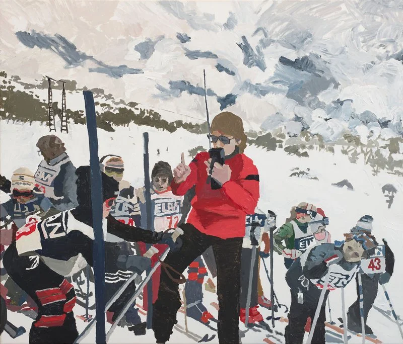 A person in a red jacket and sunglasses taking a photo at a snowy ski race with children and teenagers in racing gear in the background.