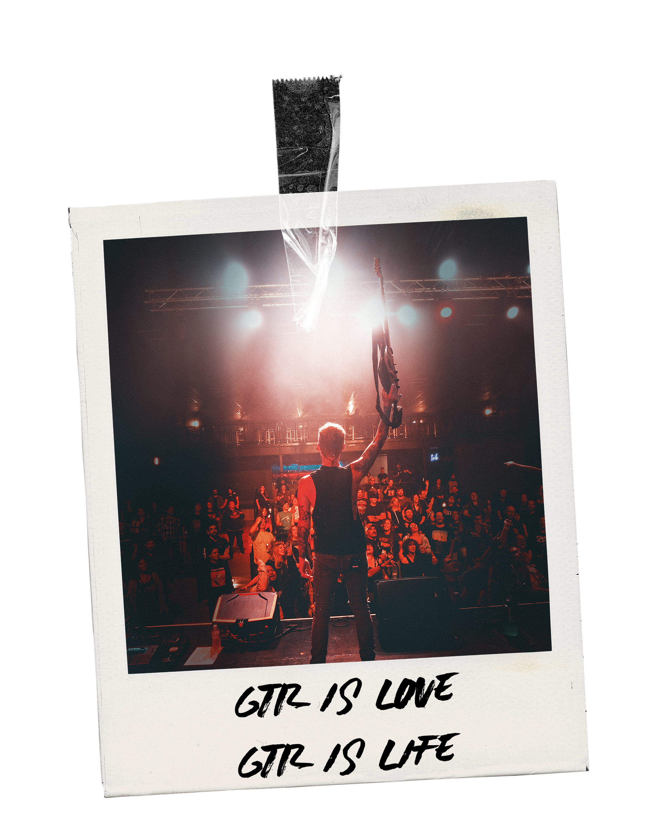 A performer on stage at a concert, holding a guitar above their head, with an audience watching. The scene is illuminated by stage lights, and a caption on the photo reads, "GTR IS LOVE GTR IS LIFE."
