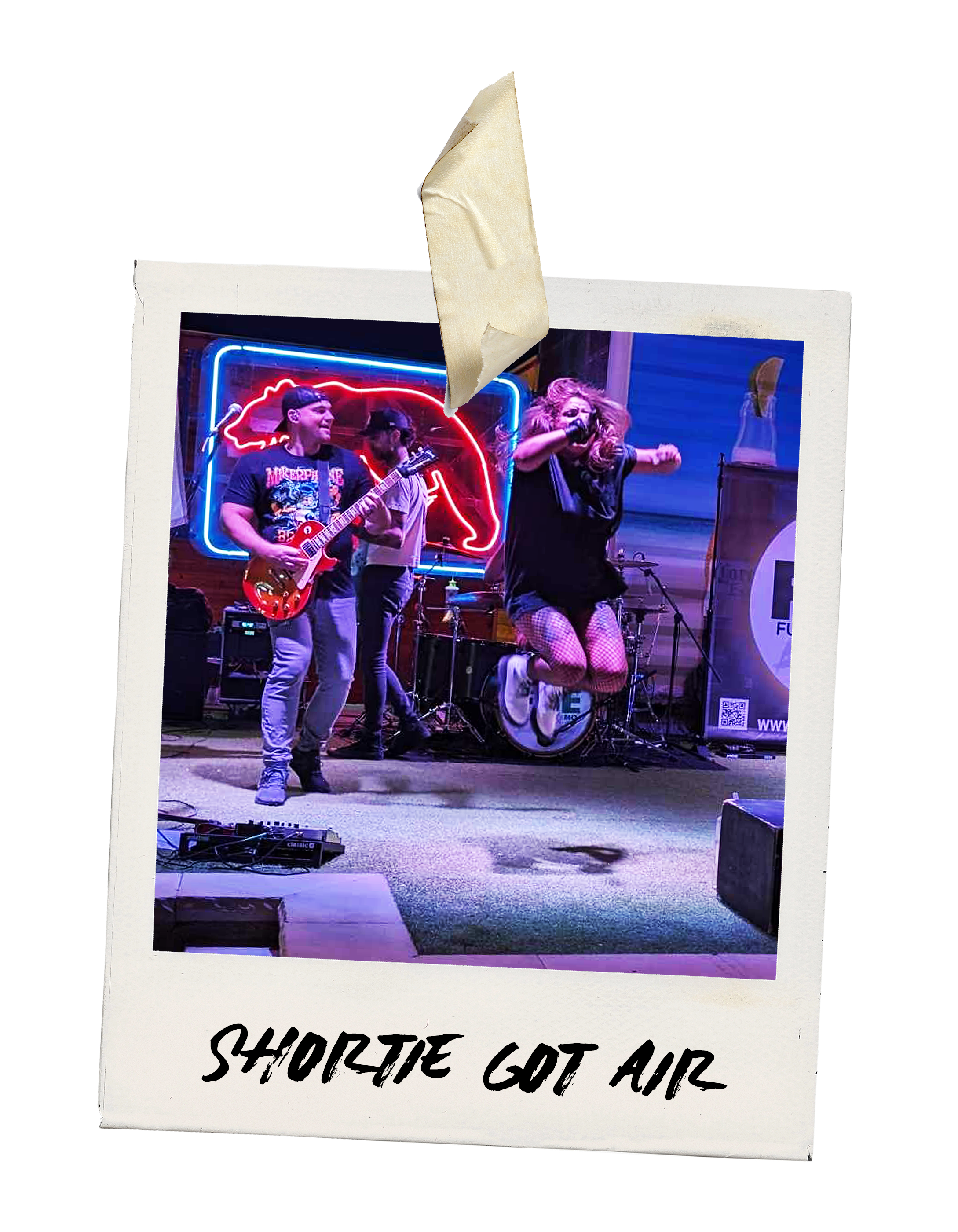 A band performing live on stage at a venue with a neon sign in the background. The vocalist is jumping with a microphone, wearing a black outfit with fishnet stockings. Two other musicians are playing guitar and drums. The overlay text reads 'Shortie