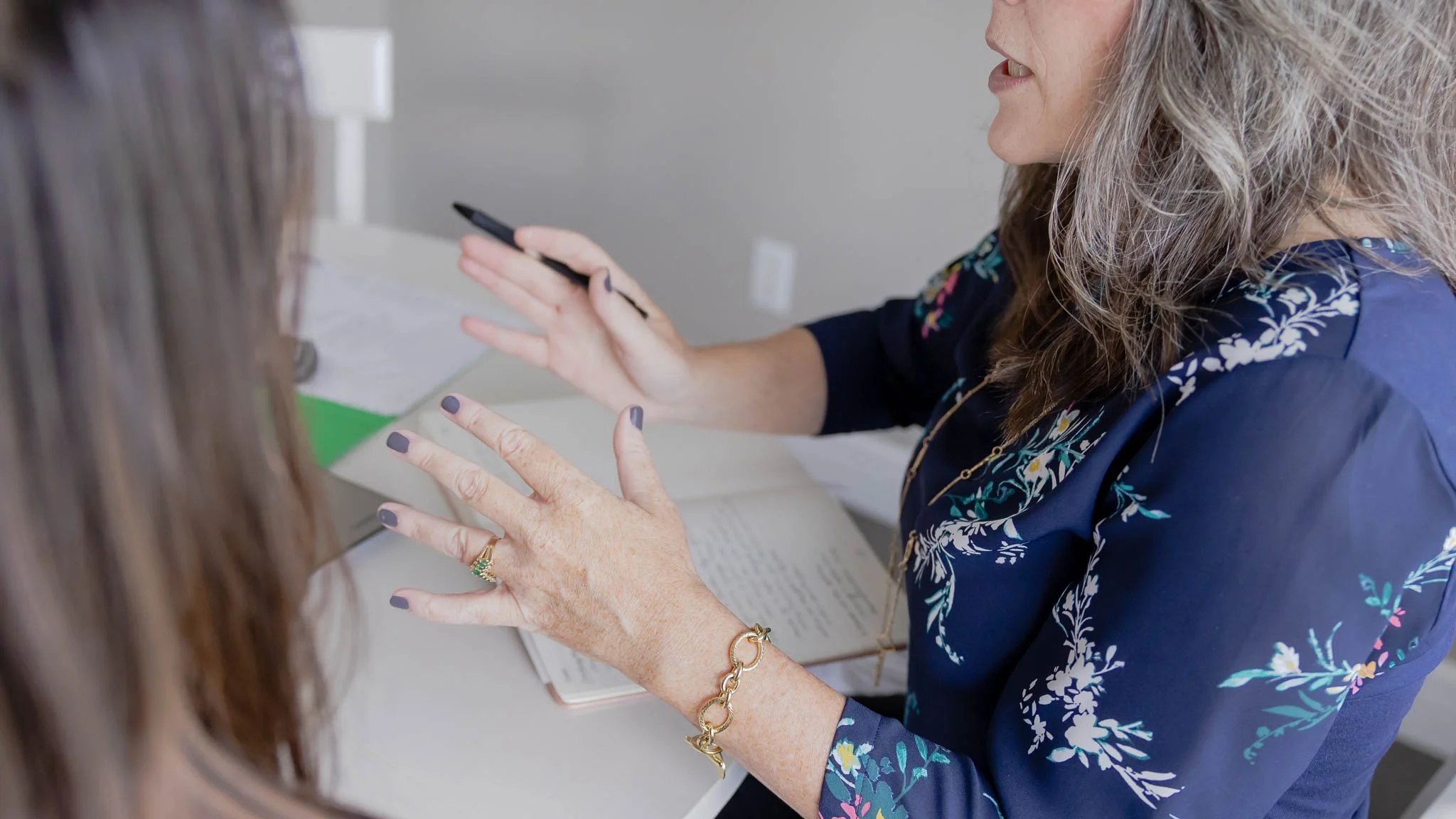 Financial coach helping client with budget.