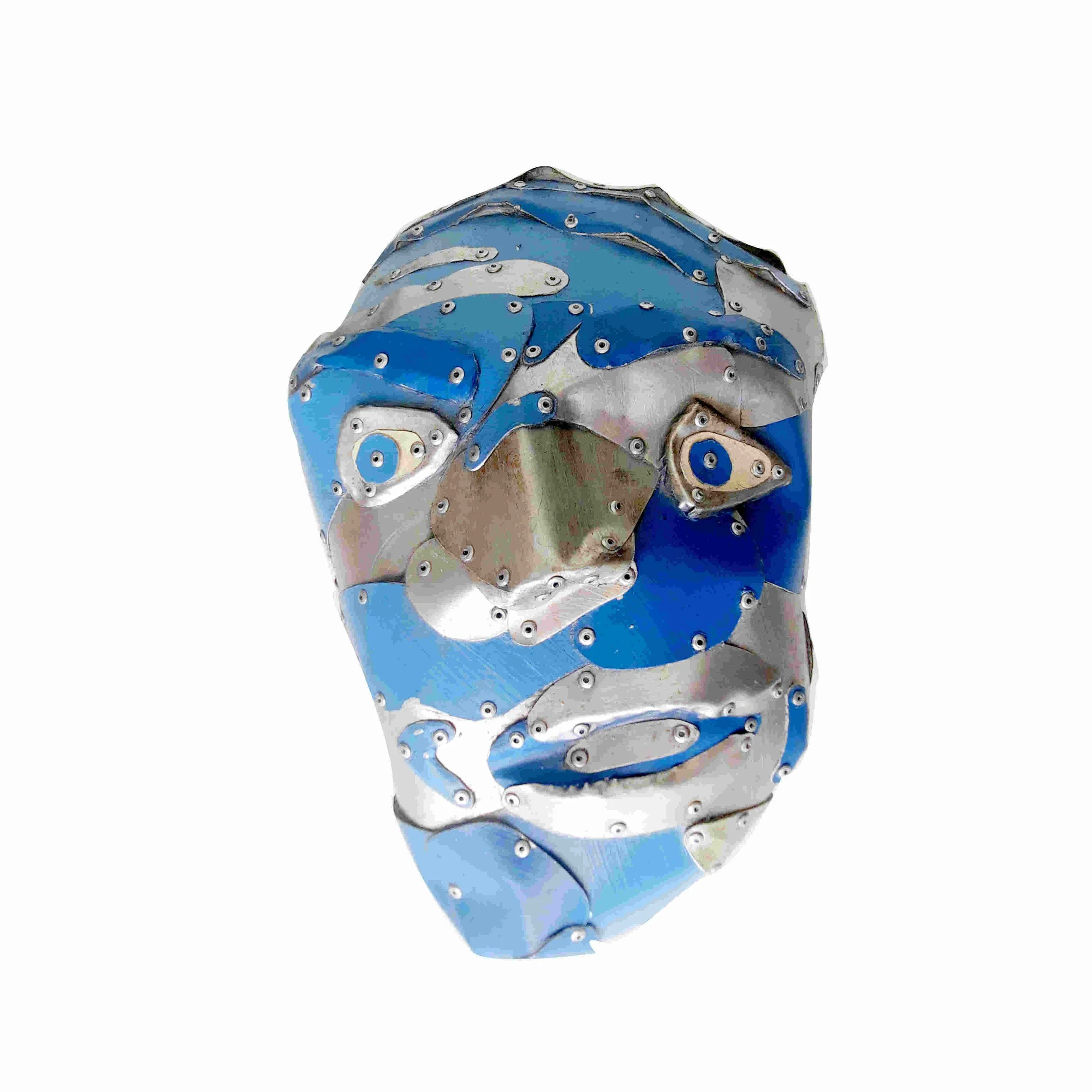 Wall Head #2 is a relief sculpture by artist Stephen Bond made of riveted alumunium. The face is blue and the features are silver.