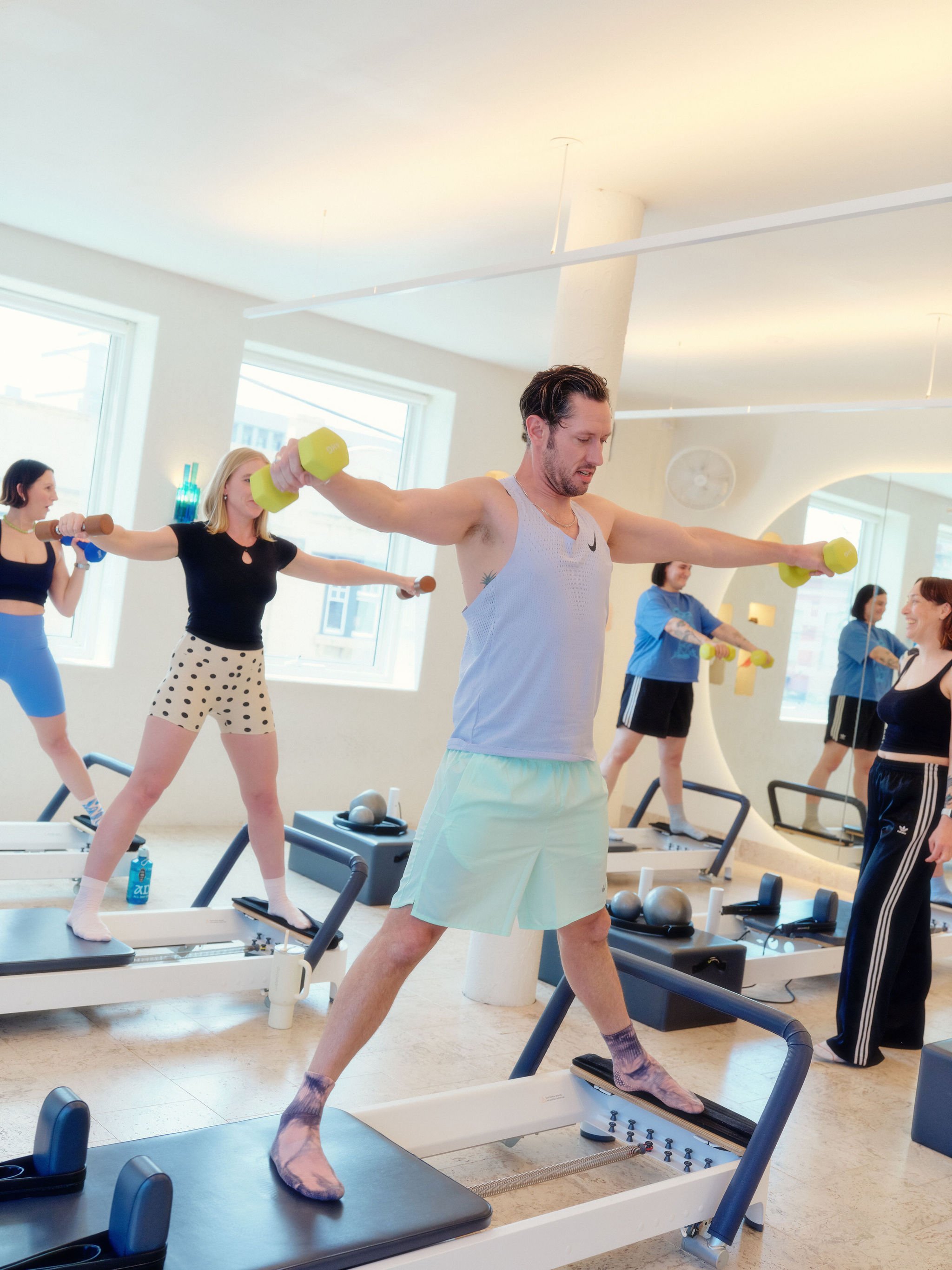 Good Times Members doing a Reformer class at Good Times Pilates