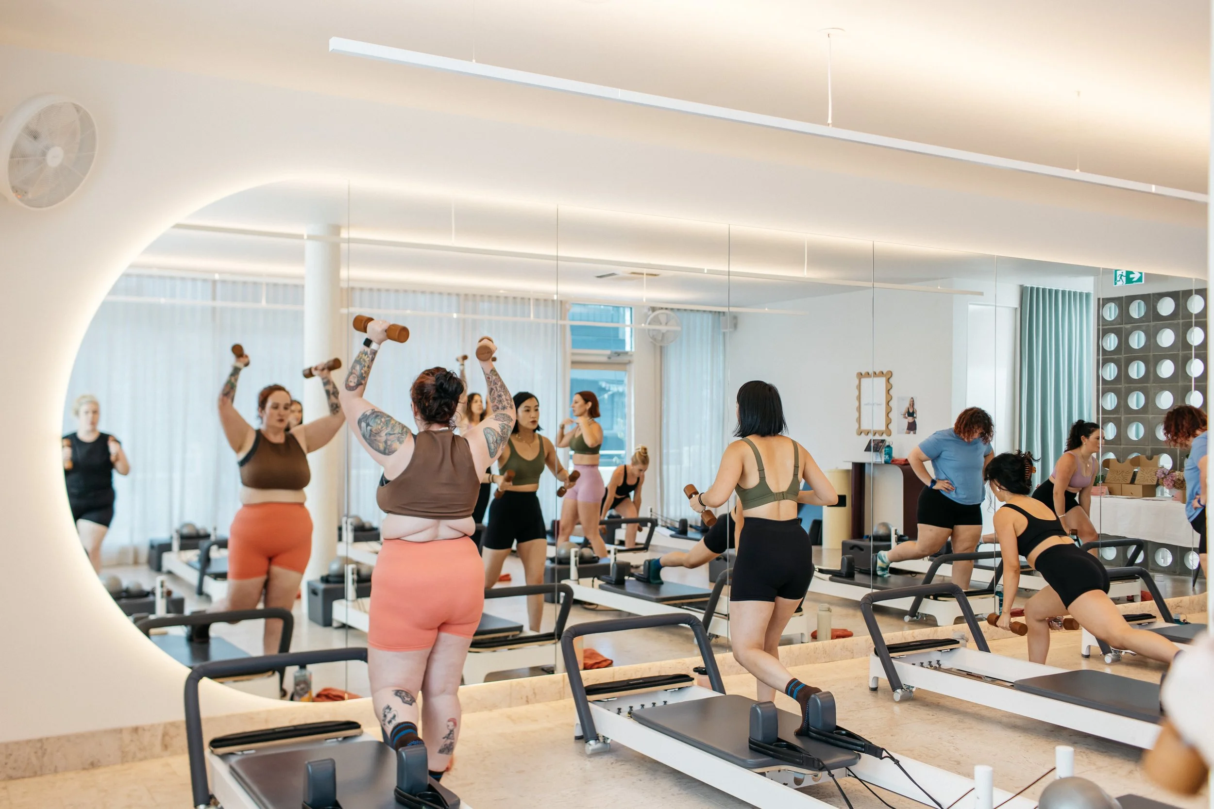 Good Times Pilates movers enjoying a group Reformer Class taught by Cat Webb.